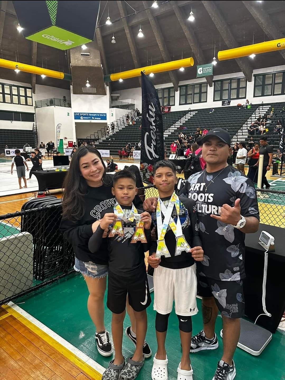 Tate and Trey pose for a photo with their medals alongside their parents Kianna and Paul Manglona after competing in the 2024 Patgon Jiu Jitsu Tournament at the UOG Calvo Field House in Mangilao, Guam on Saturday, April 27.