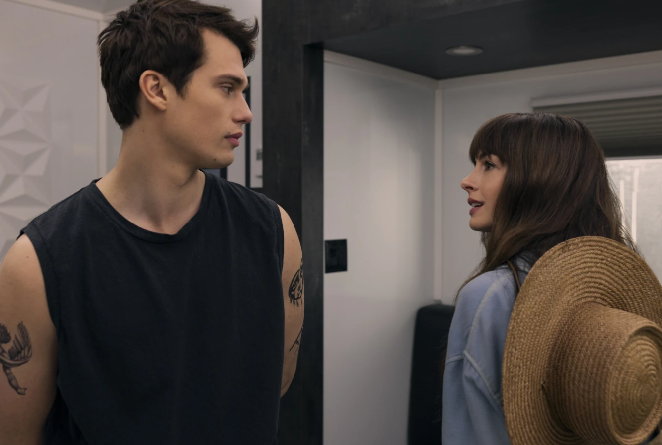 Nicholas Galitzine, left, and Anne Hathaway in a scene from “The Idea of You.”