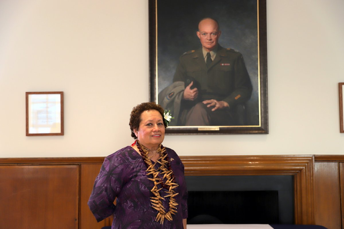 Congresswoman Amata poses with President Eisenhower's portrait in London.