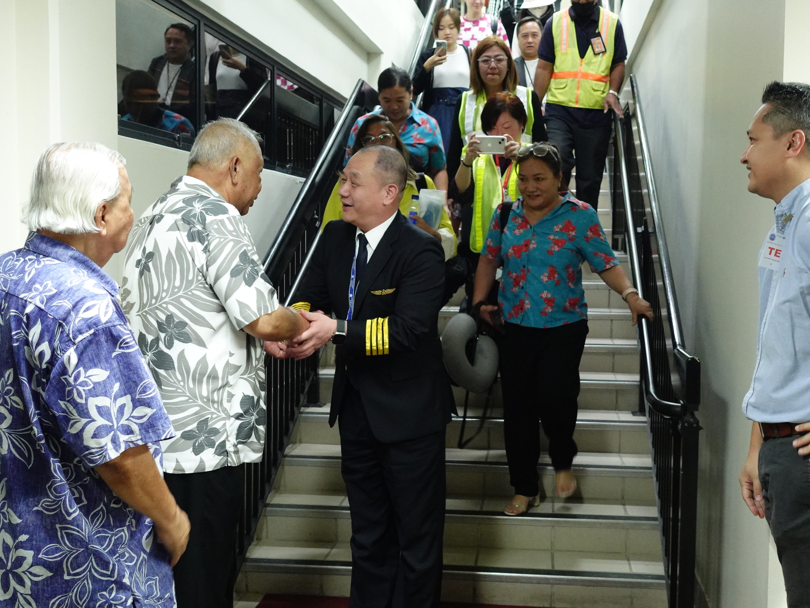 Hong Kong Airlines Chairman Jianfeng “Jeff” Sun is greeted by Lt. Gov. David M. Apatang and other dignitaries at Francisco C. Ada/Saipan International Airport in Saipan on April 29, 2024.  Sun piloted the first flight to the Marianas from Hong Kong and China since 2019/2020, marking what local officials hope will be the start of a steady rebound of the China market.  Front row from left, Commonwealth Ports Authority Executive Director Leo Tudela, Apatang, Sun, Marianas Visitors Authority Deputy Managing Director Judy C. Torres — who attended the inaugural flight ceremony prior to departure in Hong Kong — and MVA Managing Director Christopher A. Concepcion.