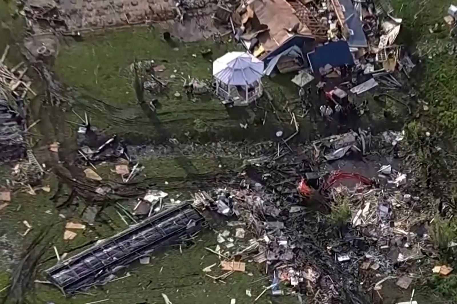 Wreckage is strewn across a property the day after a deadly series of tornados hit the central United States, in Valley View, Texas in a still image from aerial video.