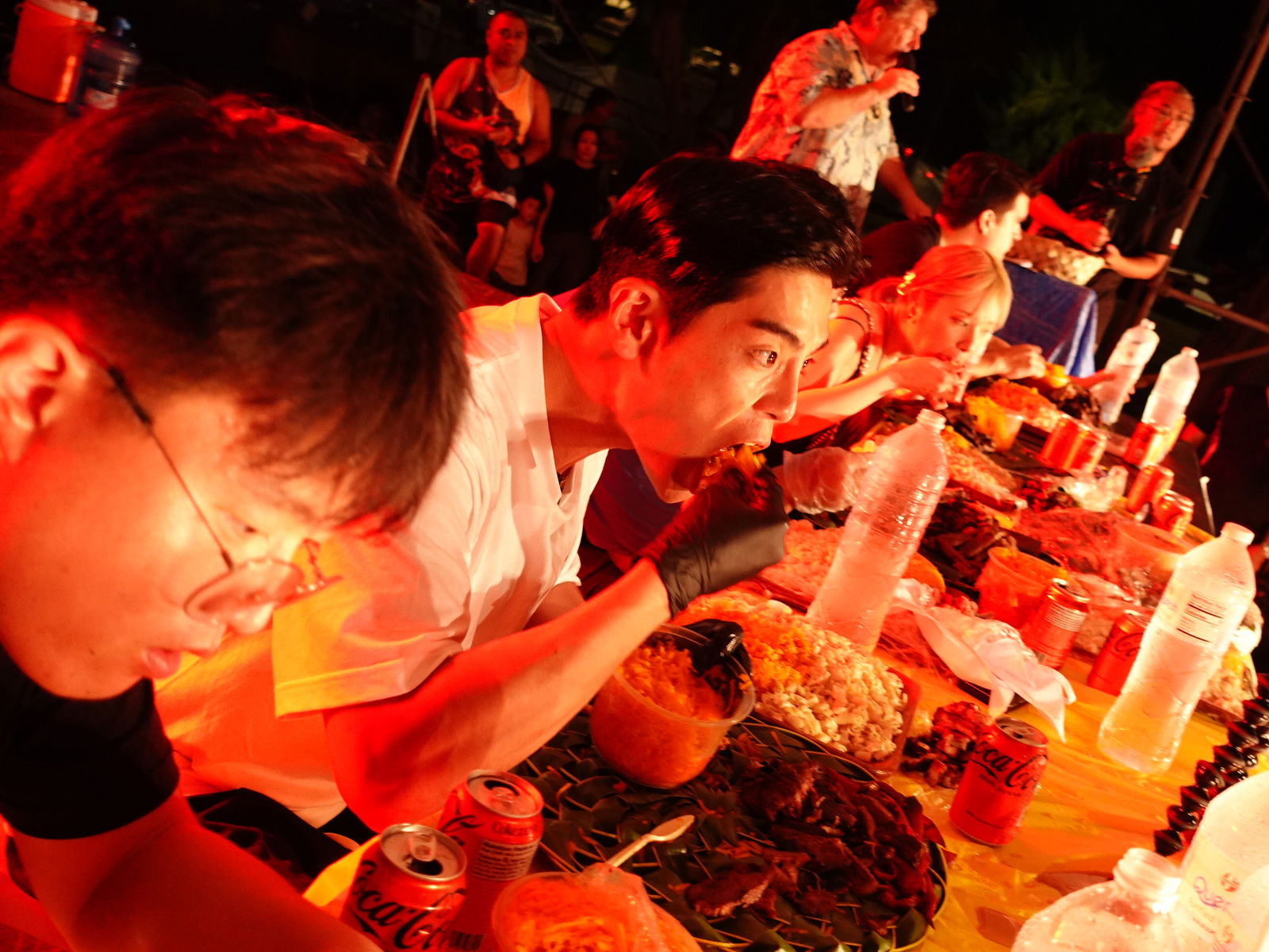 Sang Hyuk Kwon of South Korea, second left, bested four other competitors in the Oh My Grill (OMG) International Food Challenge held at the Taste of the Marianas International Food Festival on May 11, 2024, at American Memorial Park in Garapan, Saipan.  The contest challenged five competitors to finish a 12-lb. platter of Marianas-style barbecue.