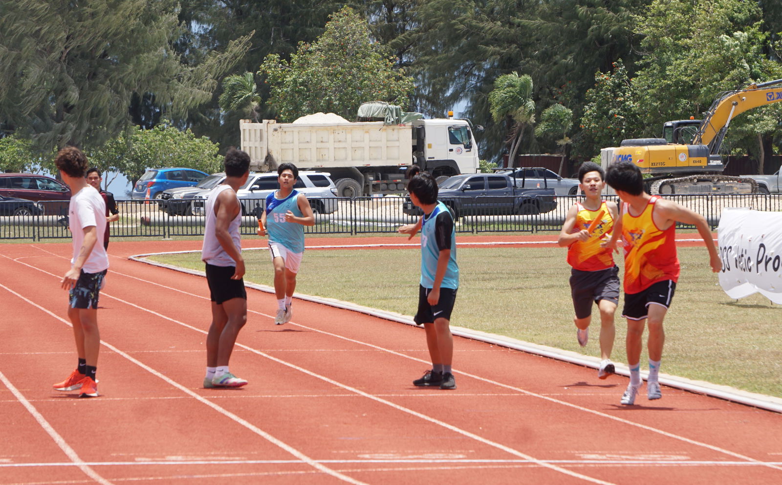An ACS runner is about to hand the baton to his teammate in the boys high school division’s 4x400 event of the McDonald's-PSS All School Track & Field (Athletics) SY23-24 at the Oleai Sports Complex on Saturday.