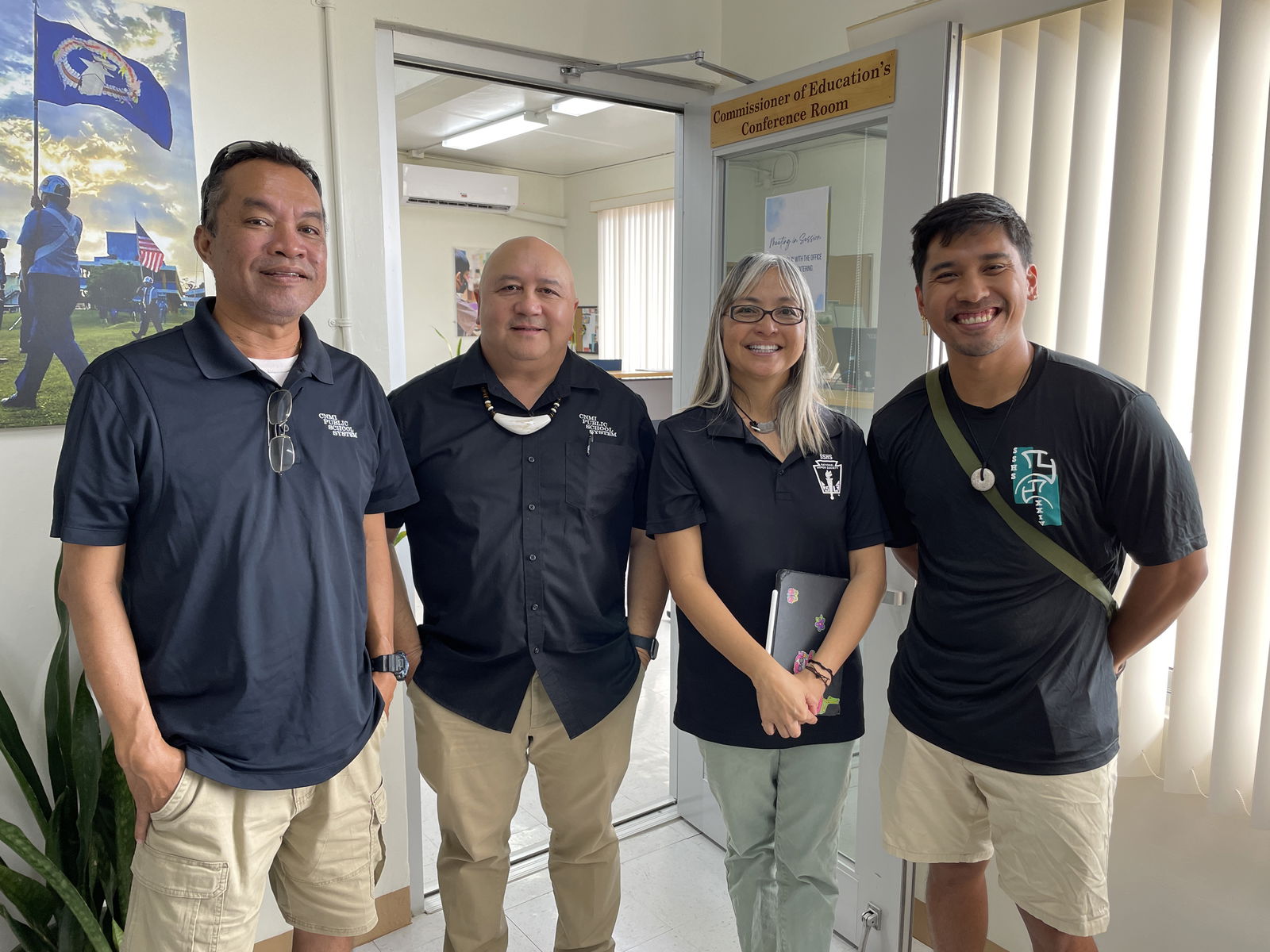 SSHS Principal Vince Dela Cruz, left, Board of Education Teacher Representative and AP research course adviser Dr. Dora B. Miura, 2nd right, and fellow adviser Kadmiel Rey, right, with Commissioner of Education Dr. Lawrence F. Camacho, 2nd left.