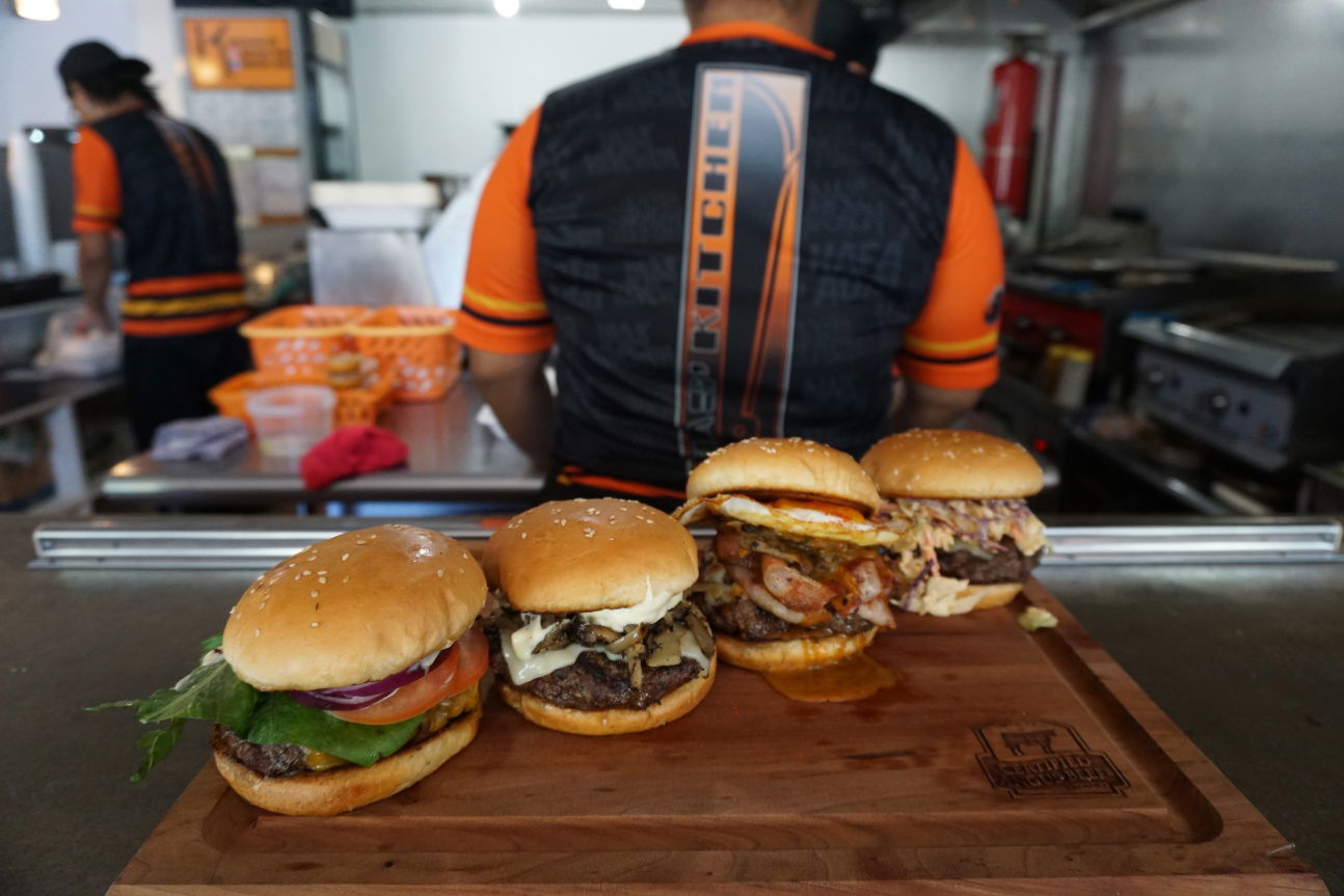 Four hot, fresh, and juicy burgers are ready for you at Inas’ Kitchen in Sadog Tasi​. From left to right are the house burger, a Swiss Burger, the Kaksaka Burger, and the Pika Burger.