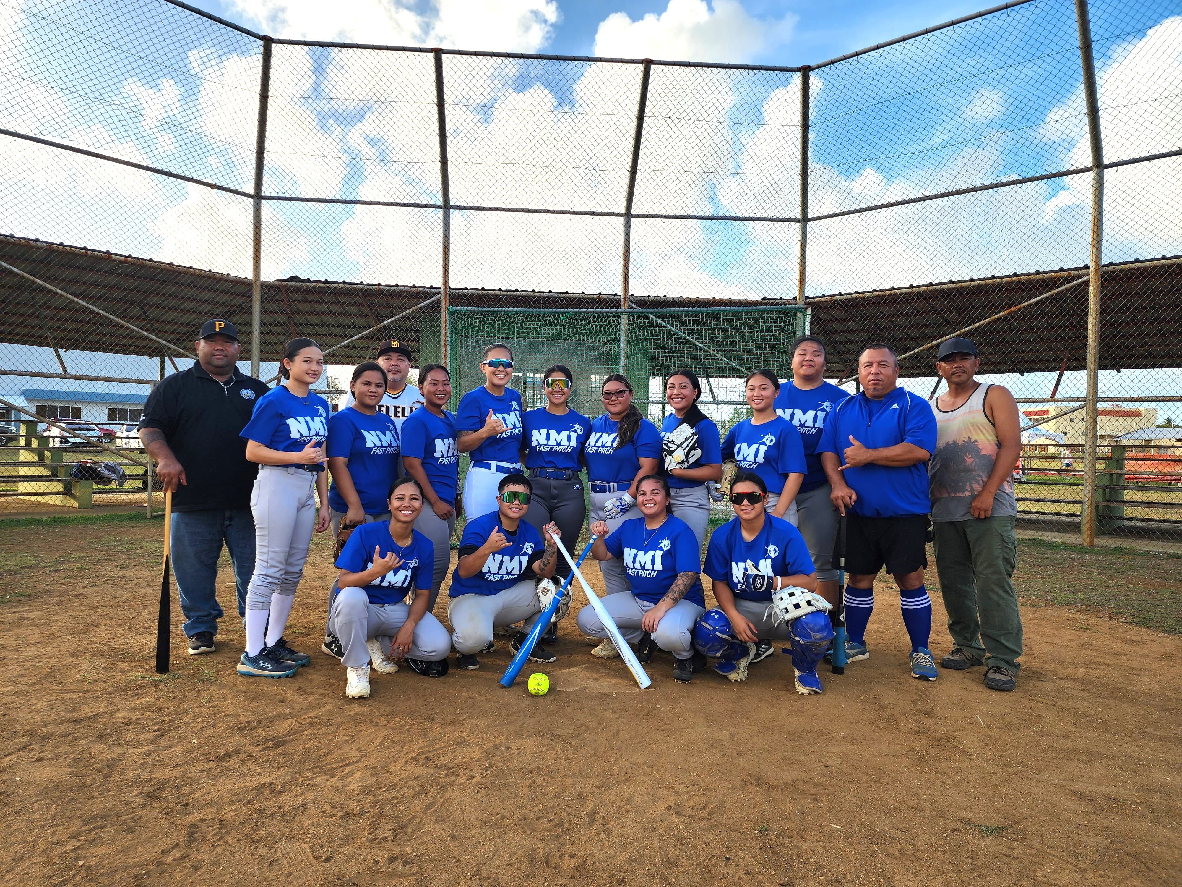 The NMI’s fastpitch softball team members pose for a photo during a break from practice at the Miguel "Tan Ge" Pangelinan Baseball Field.
