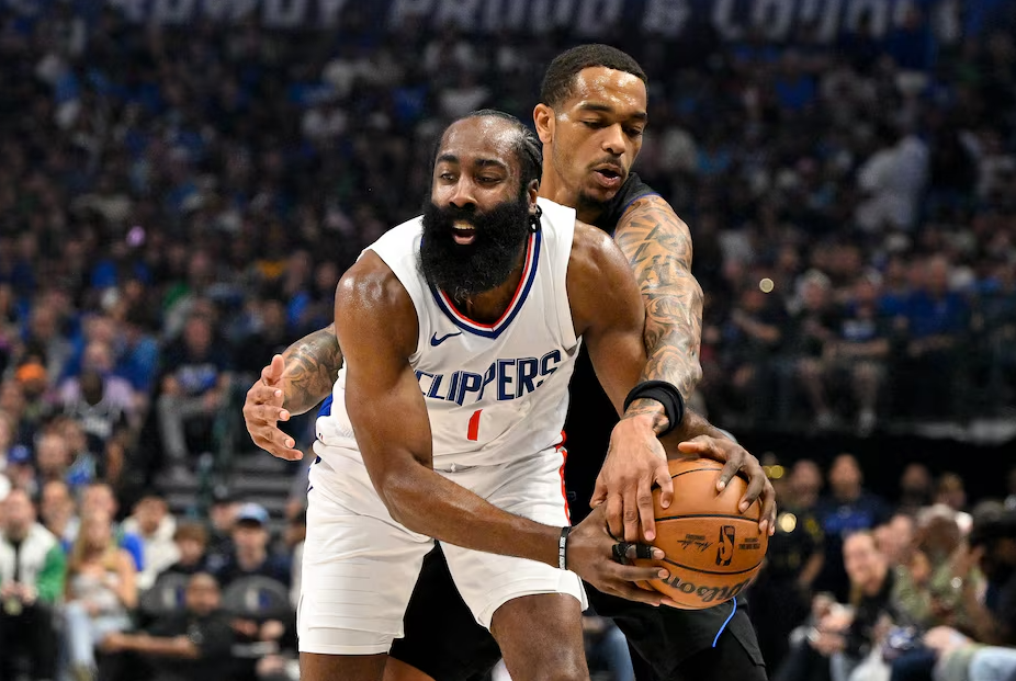 Dallas Mavericks forward P.J. Washington (25) knocks the ball away from LA Clippers guard James Harden (1) during the first quarter during game six of the first round for the 2024 NBA playoffs at American Airlines Center in Dallas, Texas, May 3, 2024.