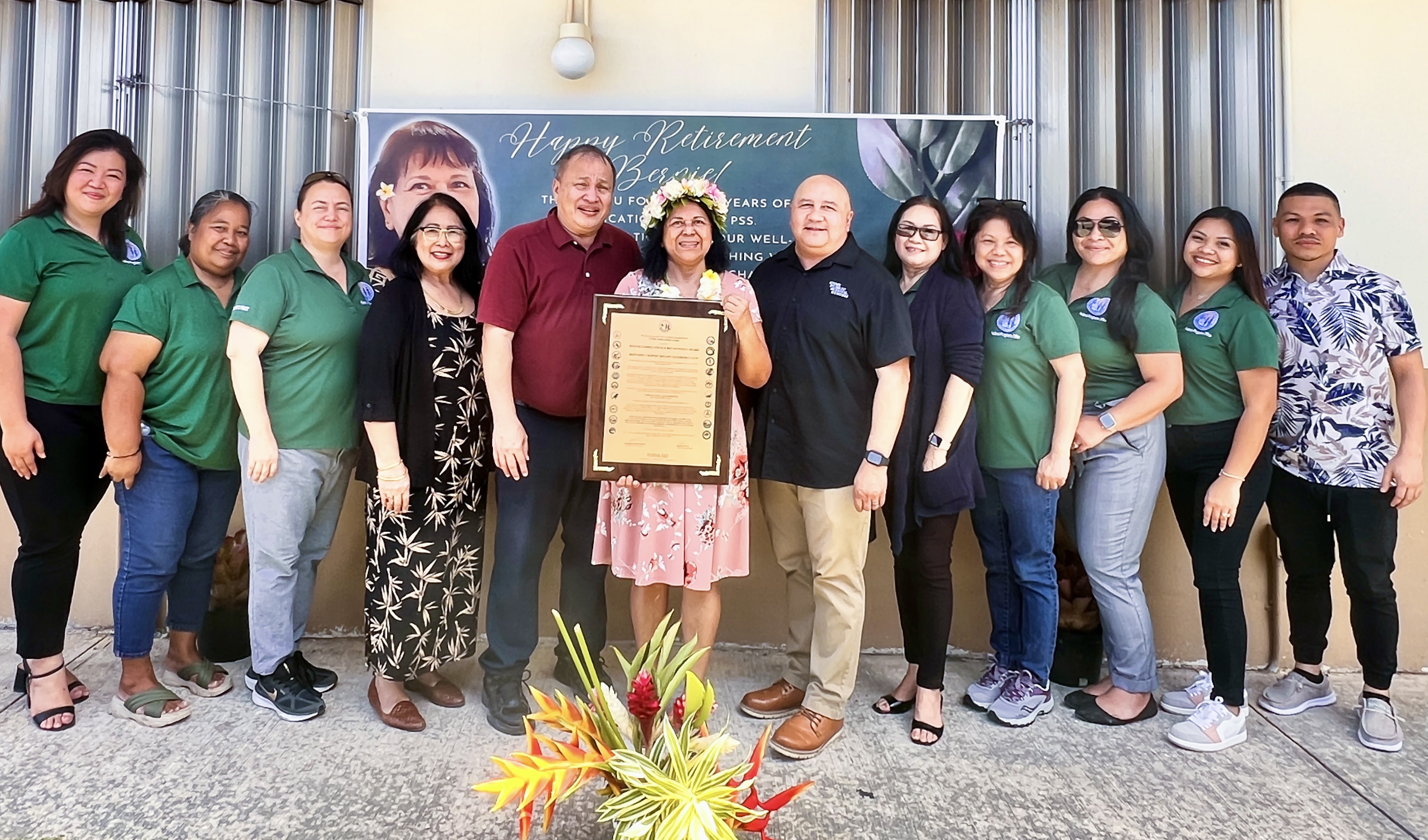 The PSS Federal Programs Director Jacqueline Che and her staff Elizabeth Romolor Melisha San Nicolas, Cristina Yohanan, Armie Catalla, Marian Tudela, Marie Quitugua, Michelle Cruz and Peter Arriola pose for a photo with Board of Education Member Andrew L. Orsini and Commissioner of Education Dr. Lawrence F. Camacho as they honor retiring PSS Federal Programs employee Bernardito DLG Calvo.