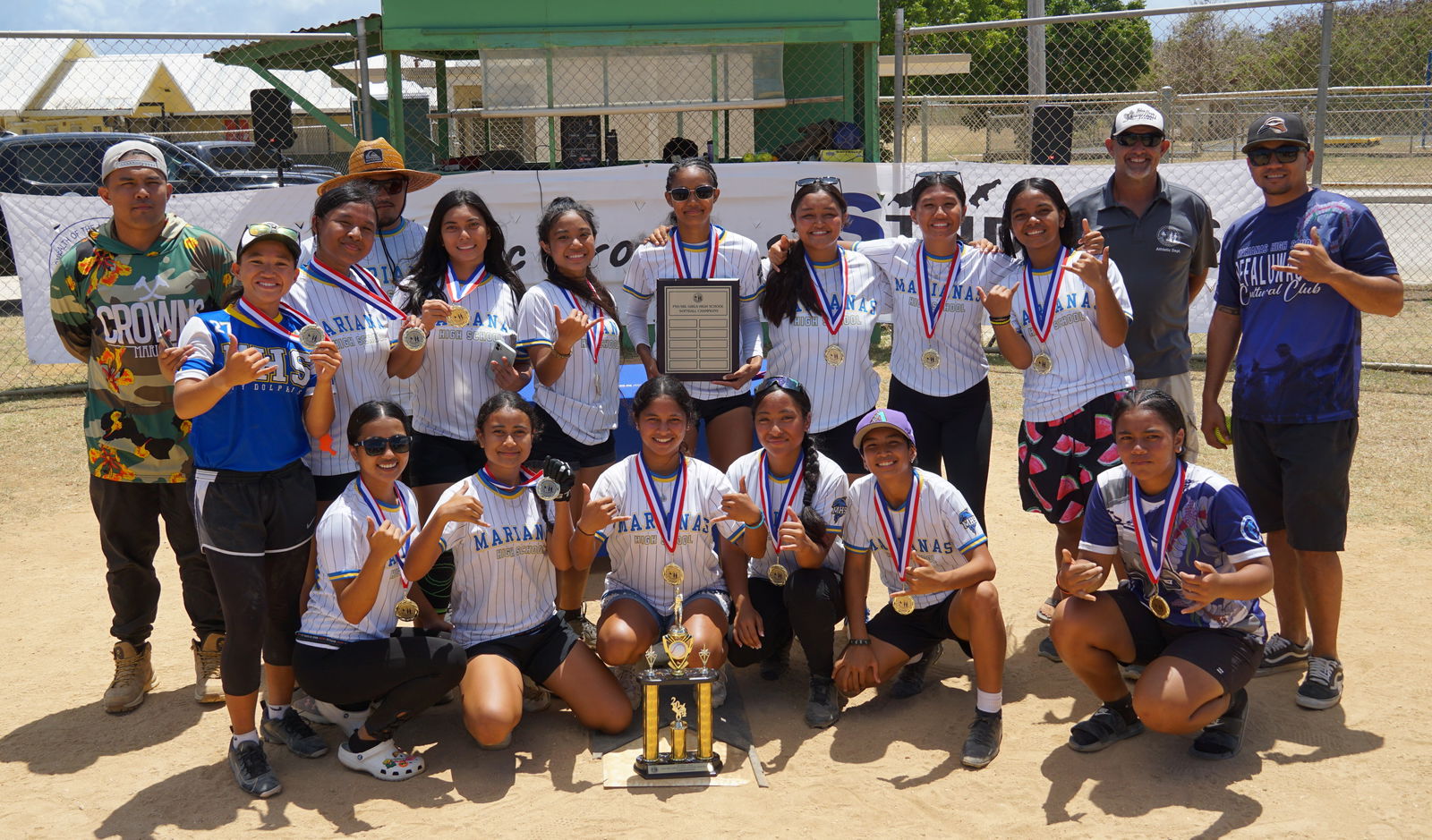 The Marianas High School team members pose with the girls high school division championship trophy after winning the inaugural SBL-PSS Interscholastic Softball League SY23-24 at the Dandan baseball field on Saturday.
