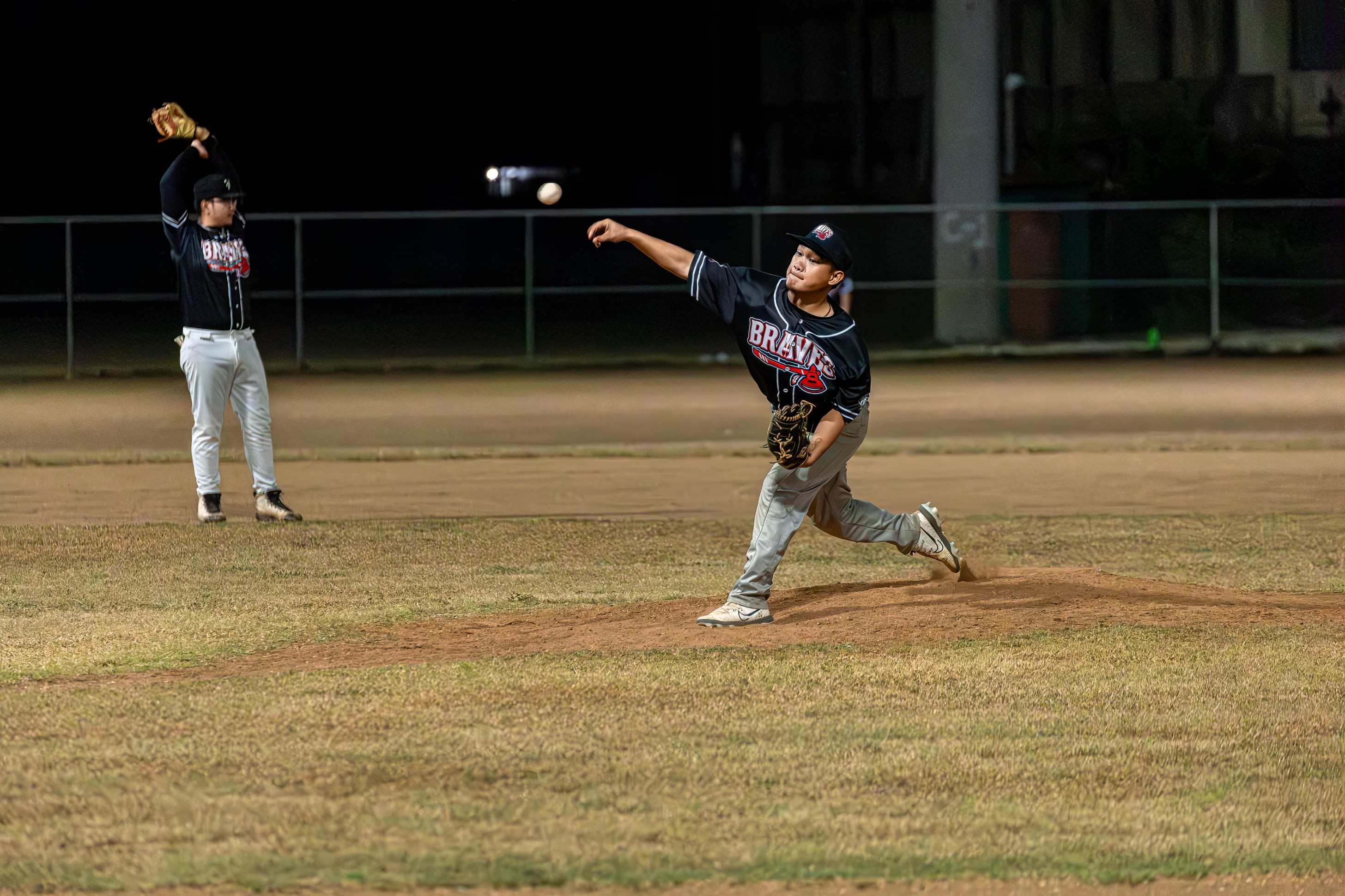 The Braves' Keoni Serrano pitches against the Sandlot during a game in the 2024 Tan Holdings Saipan Baseball League at the Francisco "Tan Ko" Palacios Baseball Field.