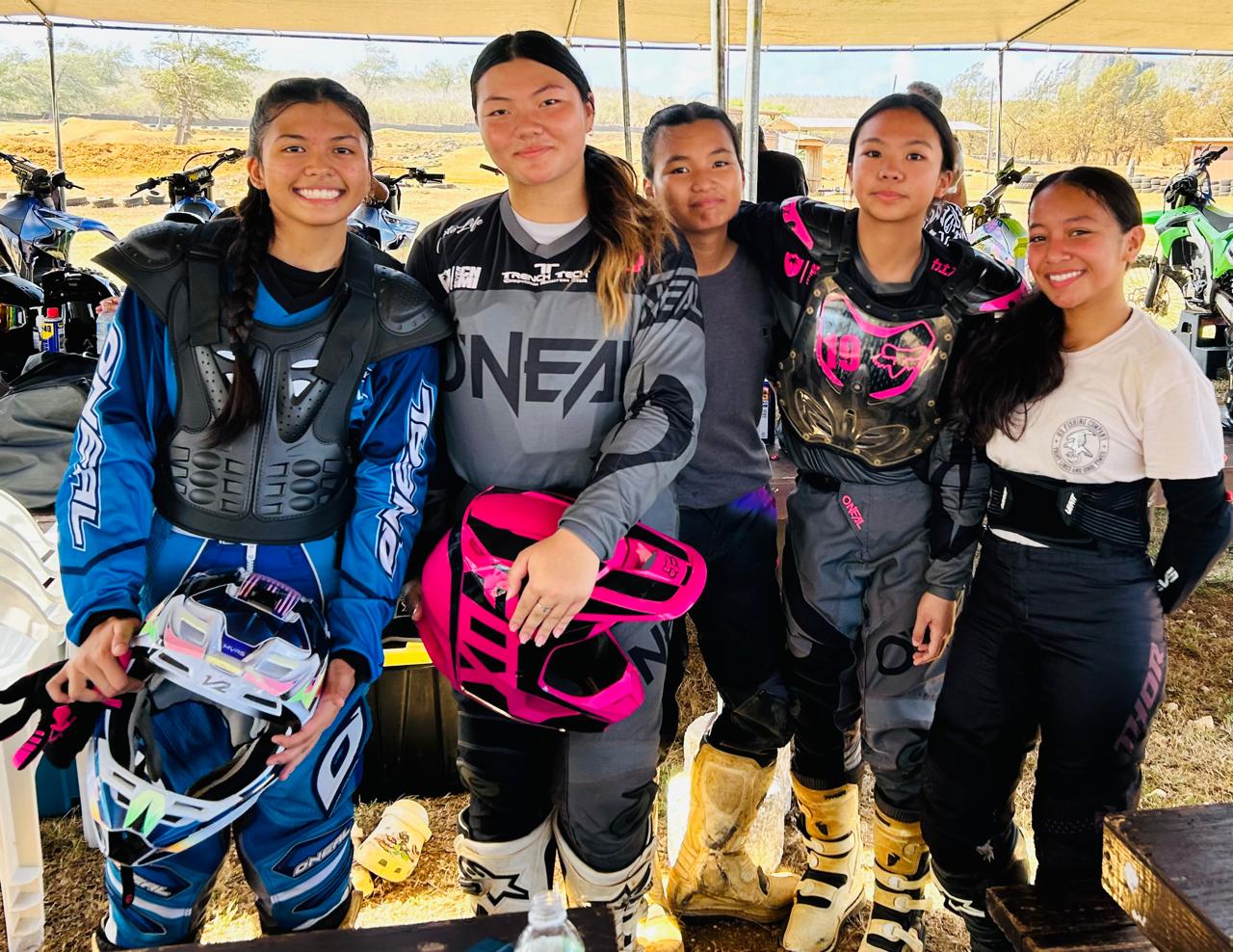 From left: Kesil Camacho, Miyako Celis, Nanako Celis, Hiromi Sasamoto and Billy Pangelinan pose for a photo before competing in the Marianas Racing Association’s “Moto IV” 2024 Points Race Series at  Cow Town Raceway Park.