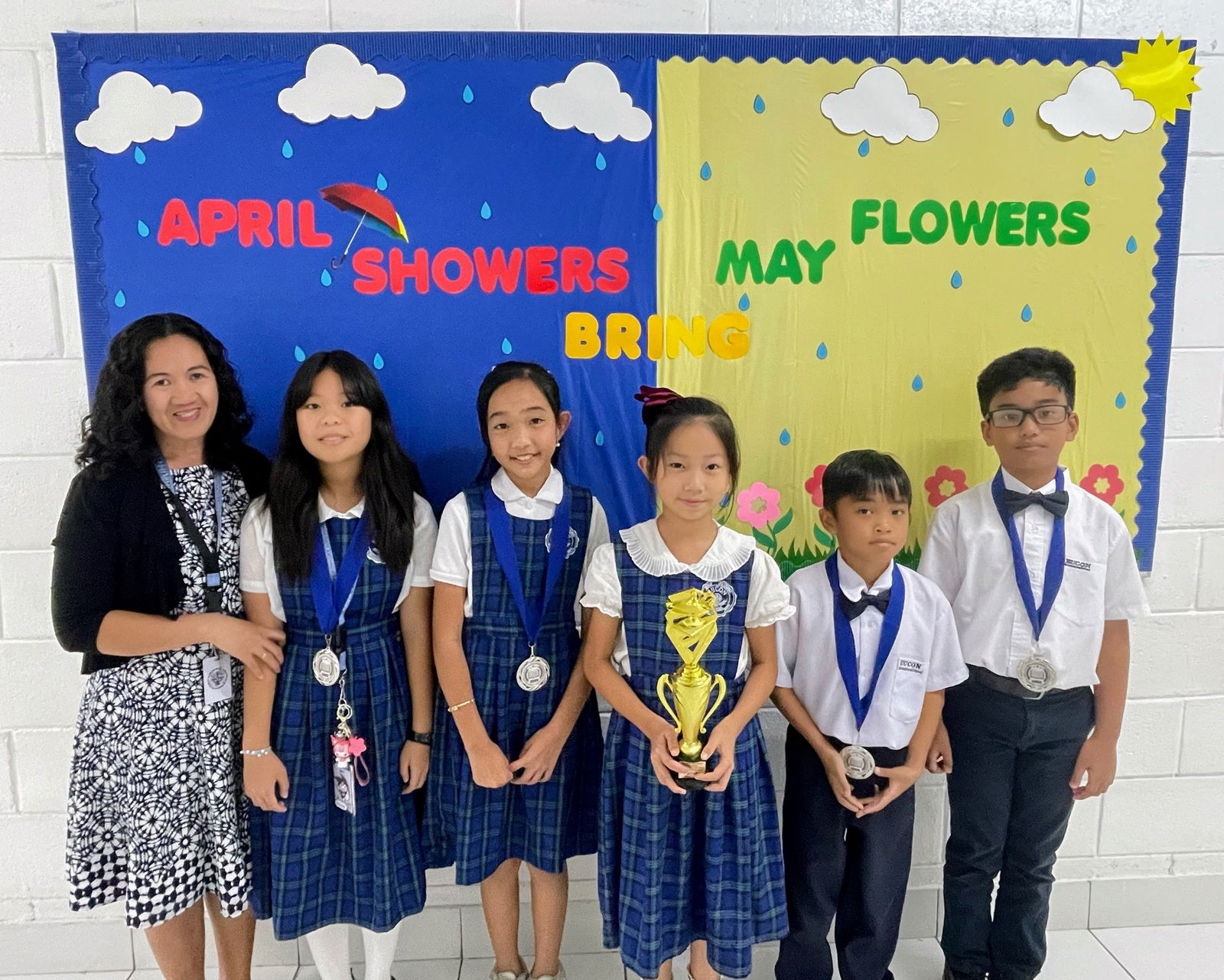 From left, coach Bernadeth Satur with Team Eucon members Stacey Lian Ramos, Janine Aryana Paras, JinXi Darya Tian, Dancel Asher Pitpit and Kenzo Jace Ramos.