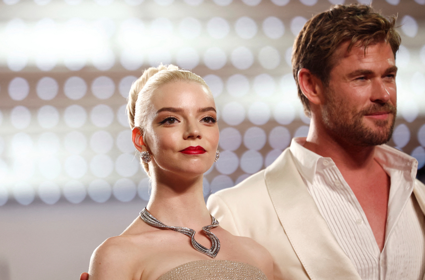 Cast members Anya Taylor-Joy and Chris Hemsworth pose on the red carpet as they leave after the screening of the film "Furiosa: A Mad Max Saga," out of competition at the 77th Cannes Film Festival in Cannes, France, May 15, 2024.