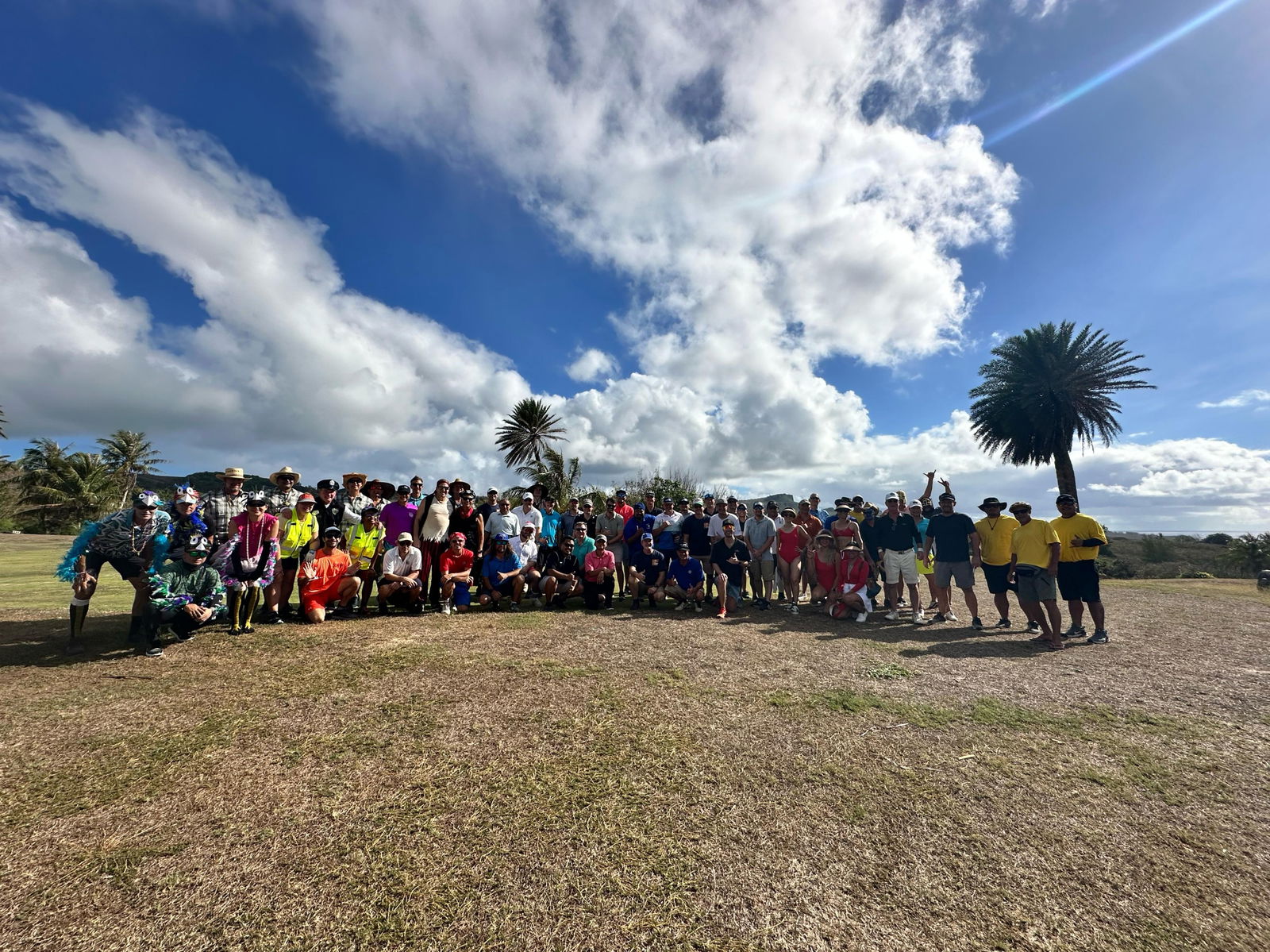 The participants of the 15th Wollak Golf Classic pose for a group shot before the start of the tournament at the Kingfisher Golf Links on Sunday.