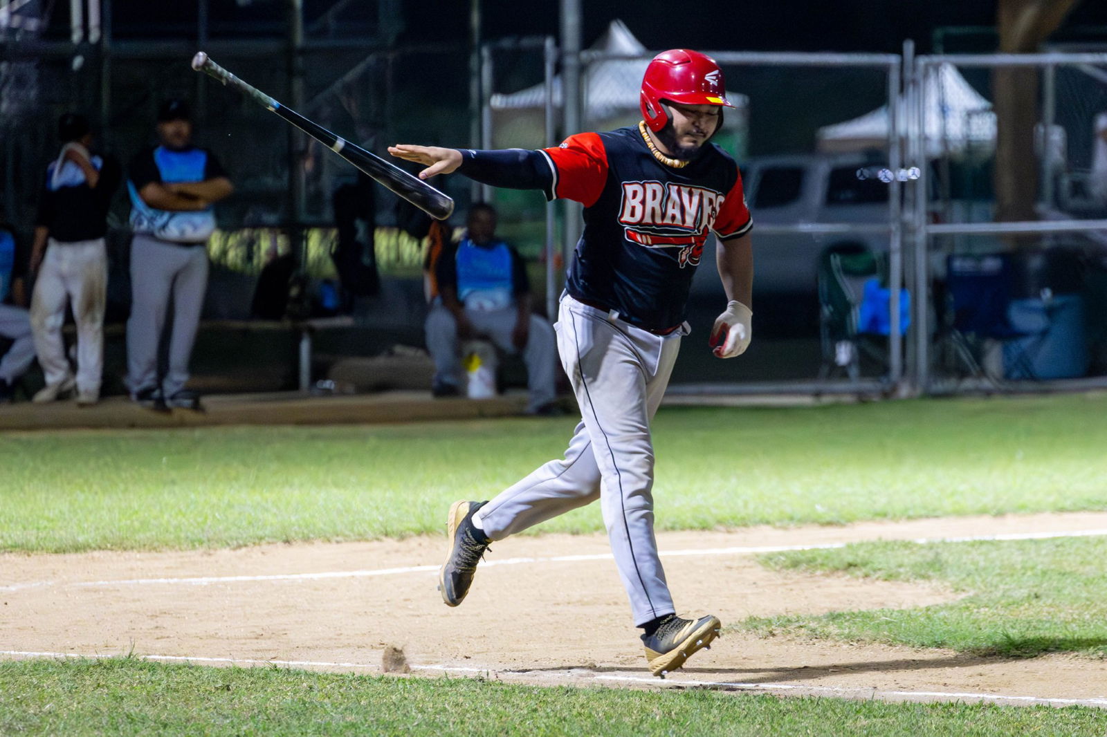 Andrew Camacho of the Braves casually makes his way to first base via base on ball during a Tan Holdings Saipan Baseball League game at the Francisco "Tan Ko" Palacios Baseball Field.