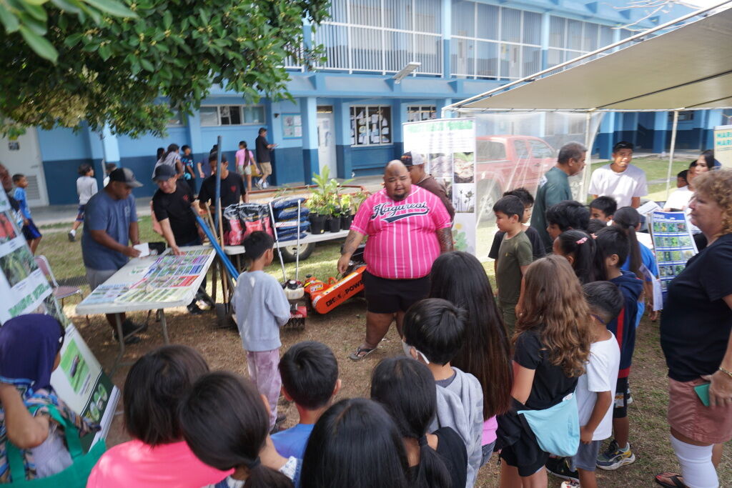 Pedro Tudela of CNMI Forestry speaks to students at a recently held science expo at Garapane Elementary School.