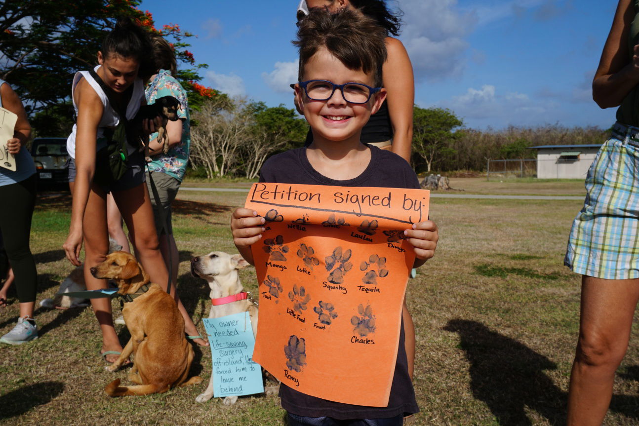A youth activist joins the protest against United Airlines organized by the Boonie Babies.