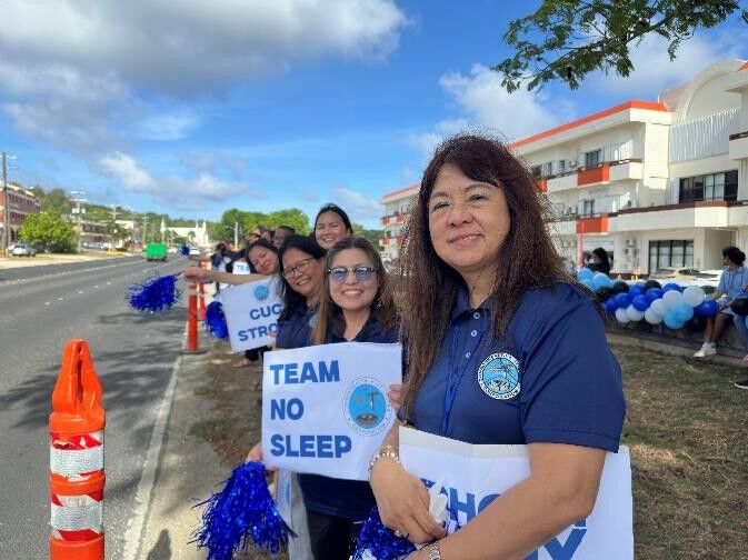 CUC’s Accounting Team members share their infectious smiles and enthusiasm while displaying their signs.