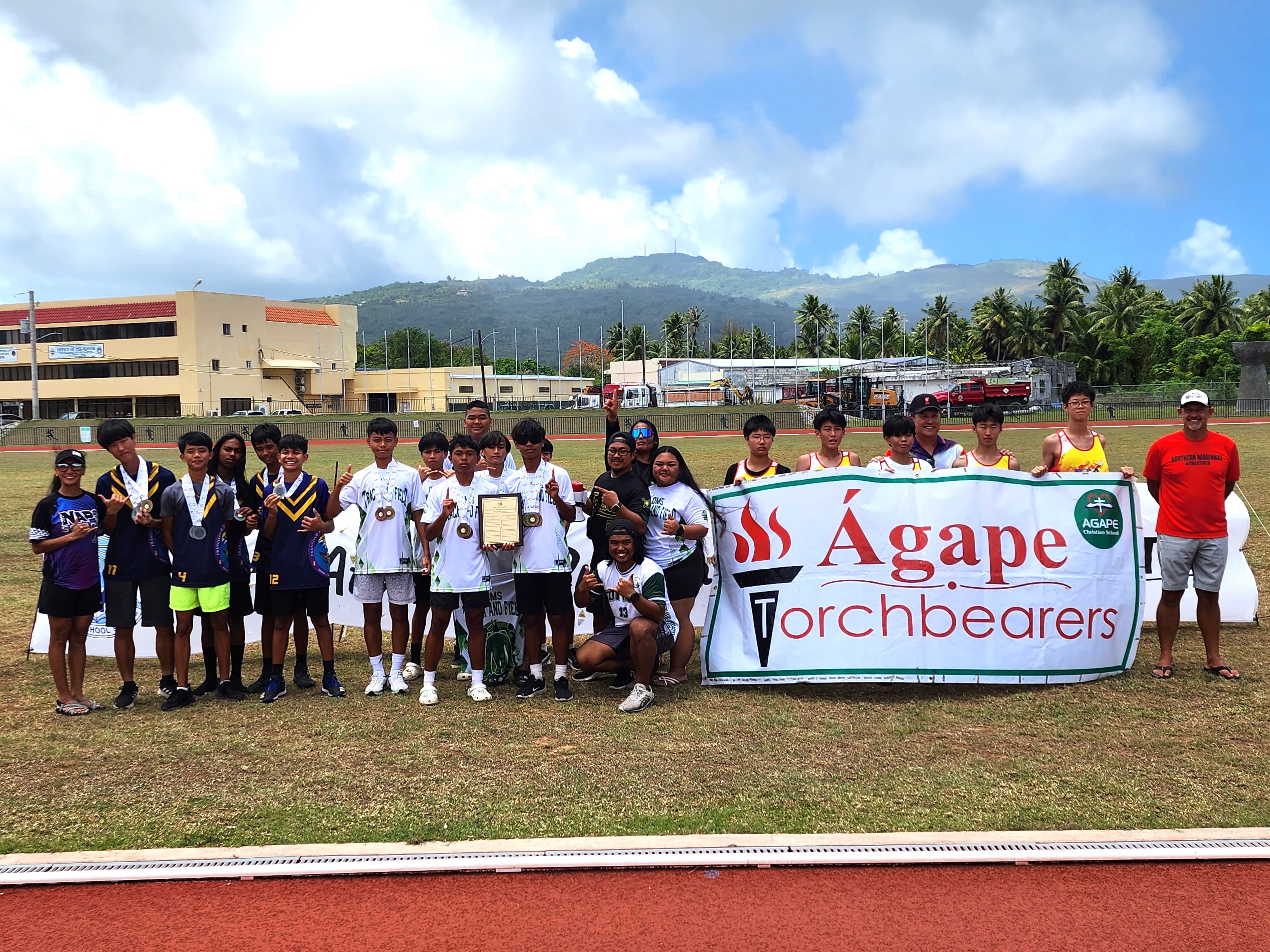 Dandan Middle School, Agape Christian School and Francisco M. Sablan Middle School athletes pose  as the top three overall winners in the boys middle school division of the McDonald’s-PSS All School Track and Field (Athletics) SY23-24 at the Oleai Sports Complex on Saturday.