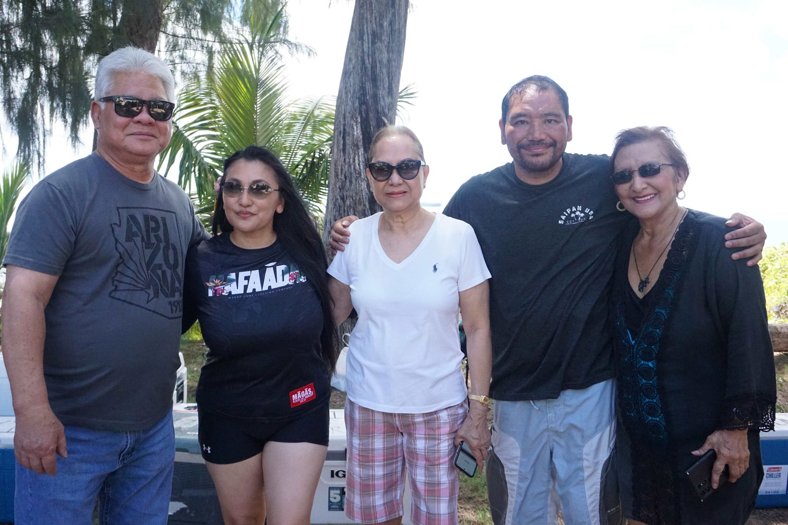 Gov. Arnold I. Palacios, left, and first lady Wella S. Palacios, center, with relatives Becky Cruz, right, Becky Lynn C. Lizama, second left, and her husband, Wilfred Q. Lizama, second right, during a family gathering at the Civic Center on Sunday.