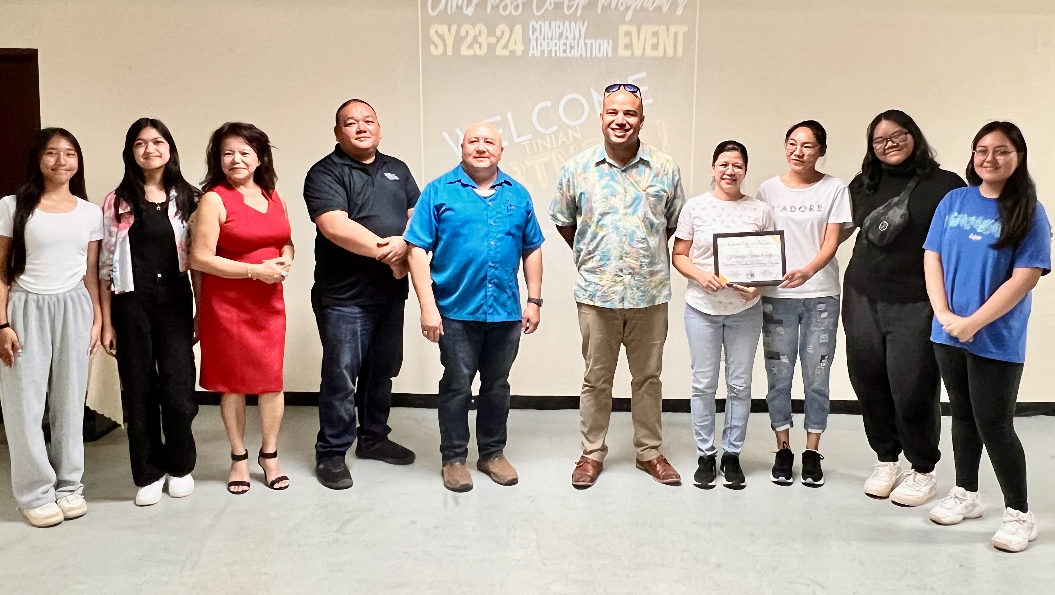 Representatives of Huang Shun Corporation, a private sector partner in Tinian, receive a plaque of recognition from PSS officials.