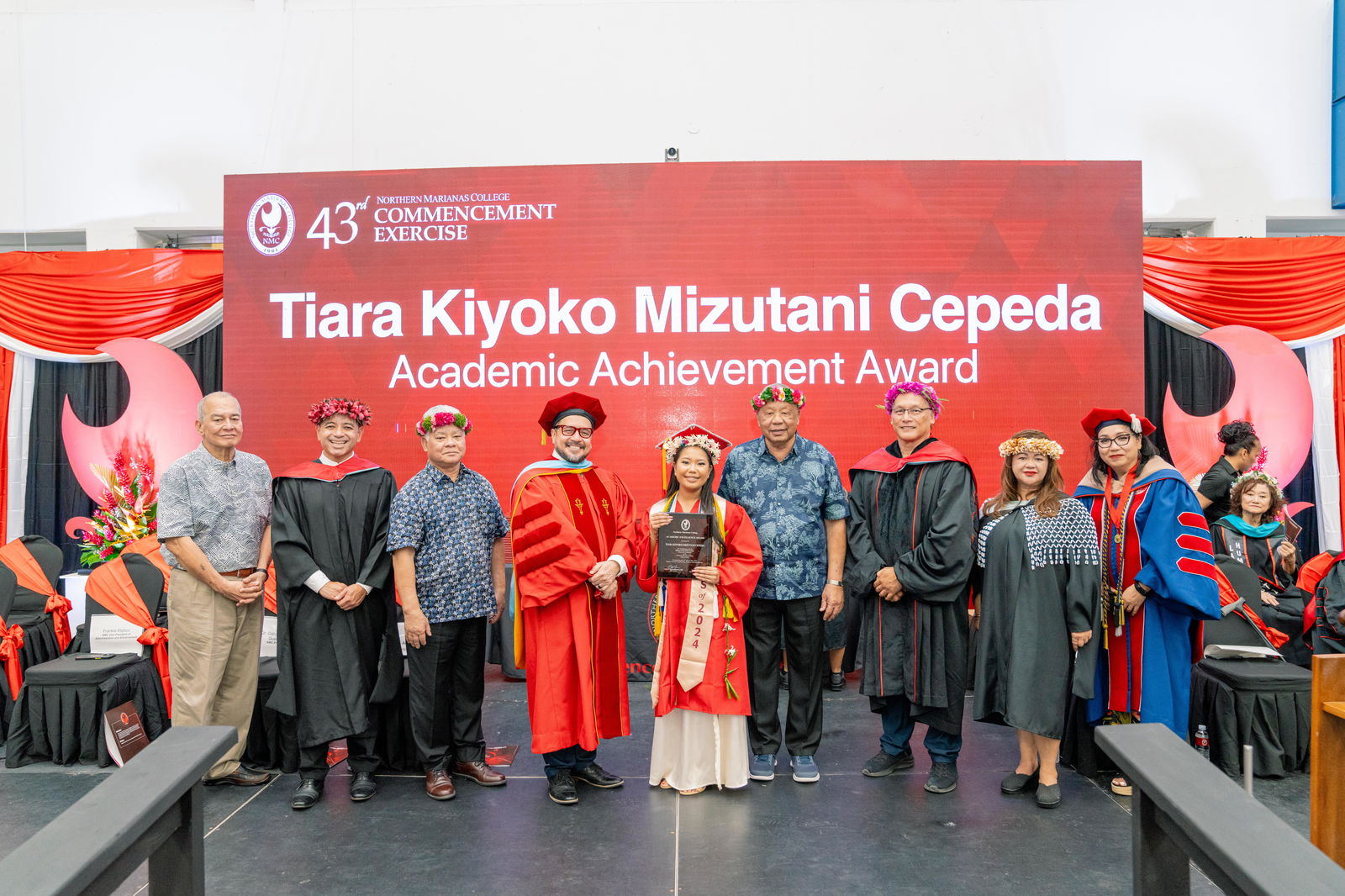 Tiara Kiyoko Mizutani Cepeda, who graduated summa cum laude with an Associate of Arts in Business, was honored with the Academic Excellence Award at Northern Marianas College’s 43rd Commencement Exercise on May 17, 2024, at the Marianas High School Gymnasium. Pictured with Cepeda, from left, are keynote speaker U.S. Congressman Gregorio Kilili Camacho Sablan, NMC Vice President for Administration and Advancement Frankie Eliptico, CNMI Gov. Arnold I. Palacios, NMC President Galvin Deleon Guerrero, EdD, CNMI Lt. Gov. David M. Apatang, NMC Board of Regents Chair Charles Cepeda, NMC Dean of Student Support Services Charlotte Cepeda, and NMC Acting Dean of Academic Programs and Services Dr. Barbara Hunter.