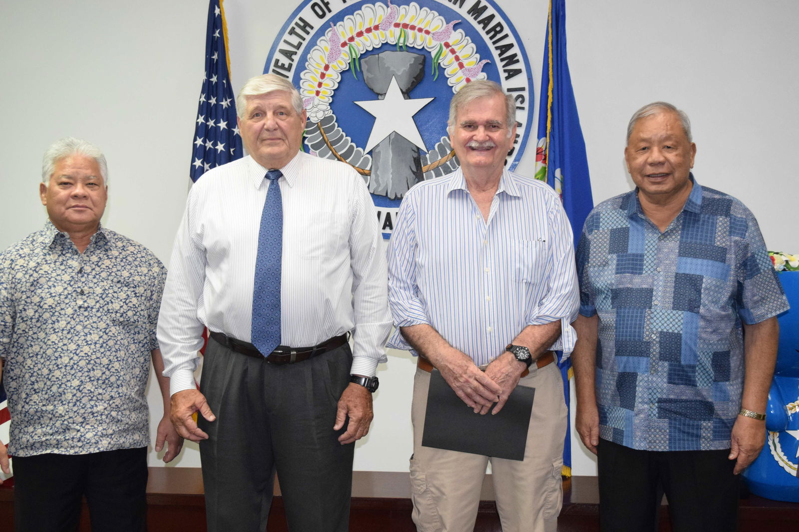Commonwealth Public Utilities Commission nominee Dr. John "Jack" Angello, second right, and CPUC Chairman James Sirok, second left, with Gov. Arnold I. Palacios, left, and Lt. Gov. David M. Apatang in June 2023.