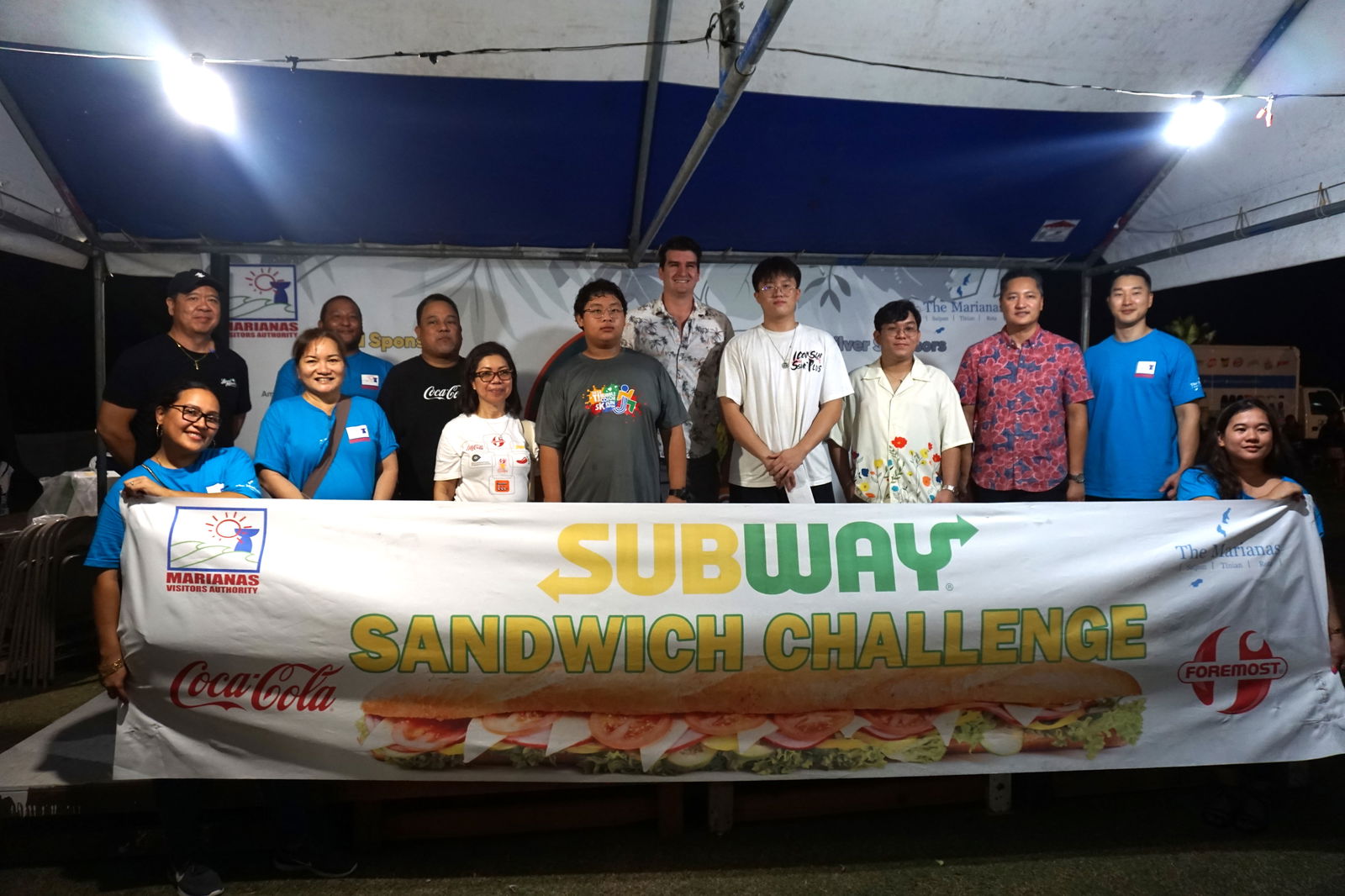 The top three winners of the Subway Sandwich Challenge: Jeremy Rother, center, Mike Yu and  Bob Yu pose for a photo with MVA  and Foremost/Coca-Cola officials.