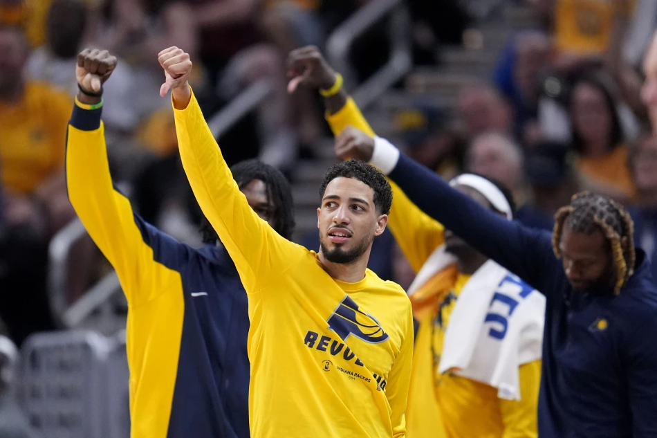 Indiana Pacers guard Tyrese Haliburton celebrates on the bench during the second half of Game 4 against the New York Knicks in an NBA basketball second-round playoff series, Sunday, May 12, 2024, in Indianapolis.