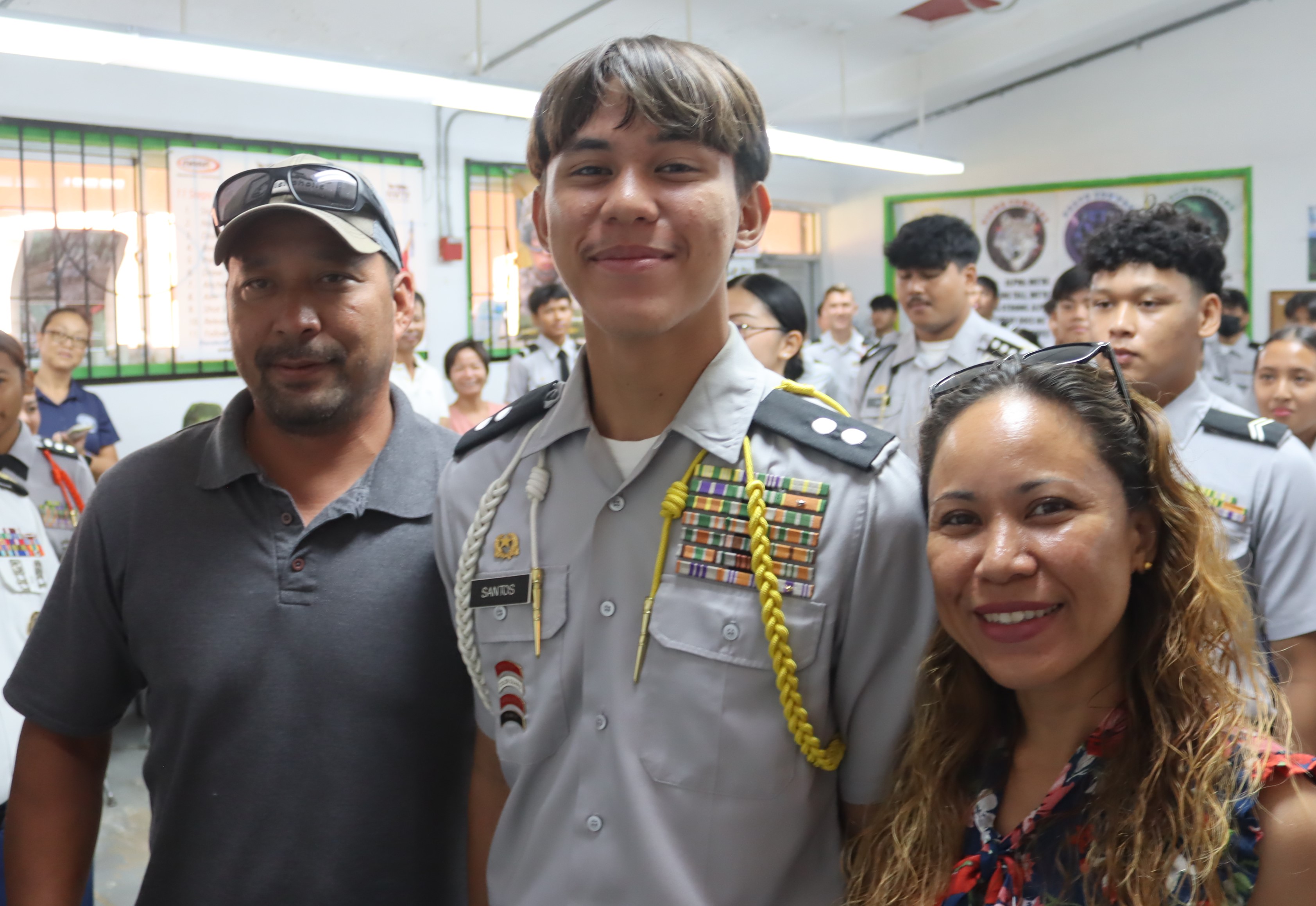 C/CPT Joseph Santos with his parents.