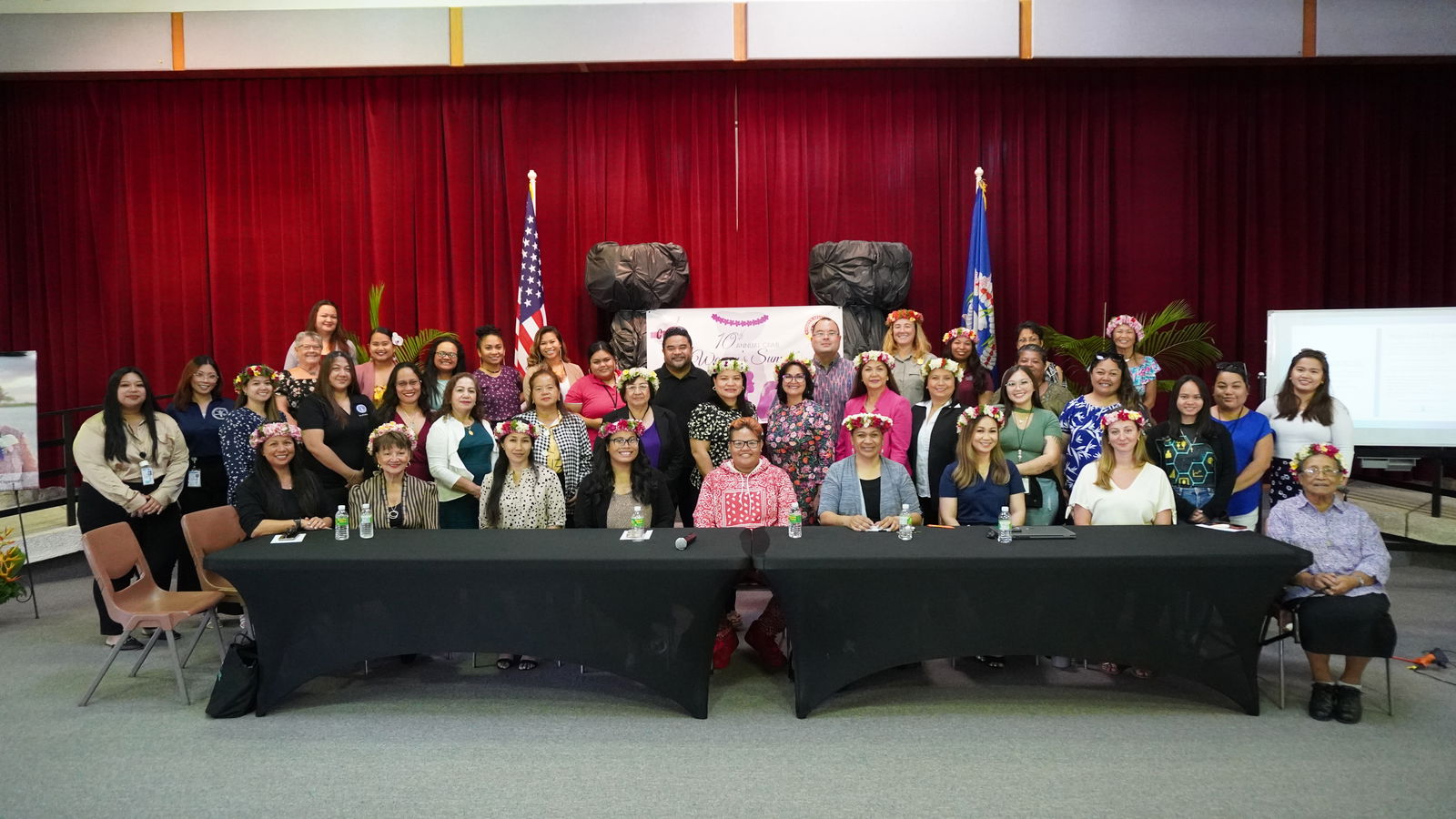 Participants of the 10th Annual CNMI Women's Summit pose for a photo at the multi-purpose center.