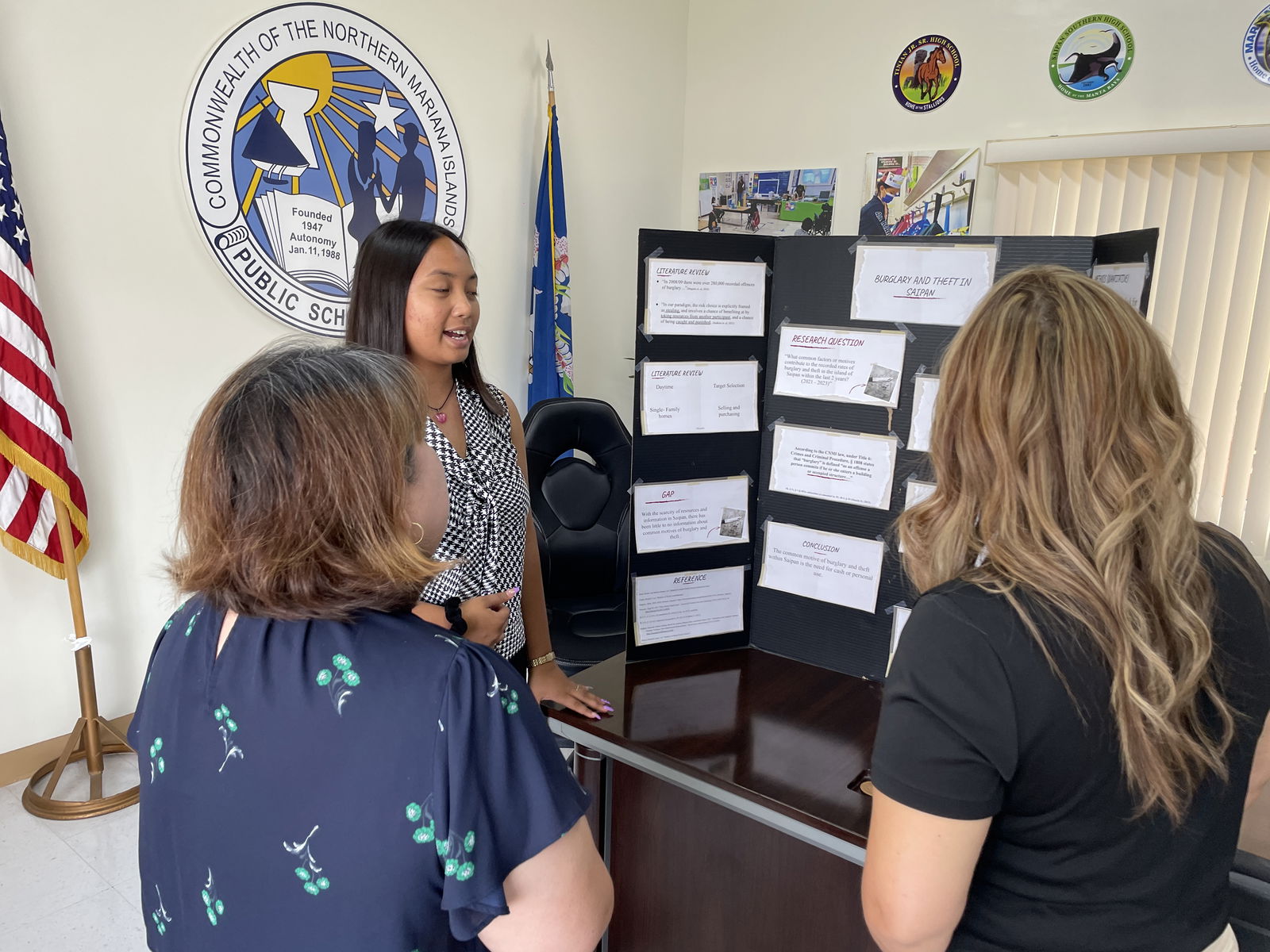 SSHS AP student Aleeza Castro presents her research on the common factors or motives that contribute to burglary and theft cases on Saipan in the last two years (2021-2023).