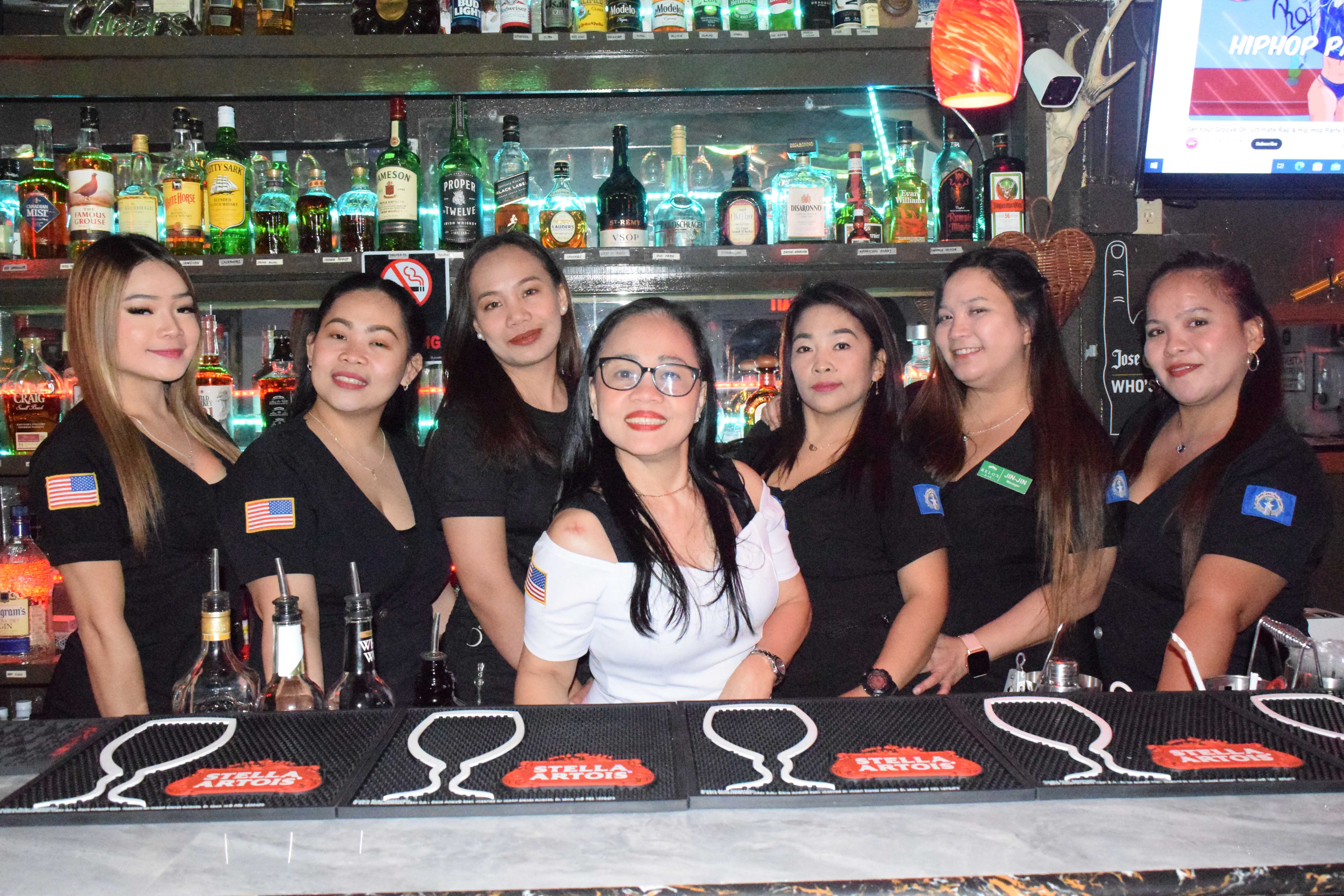 Relox Bar owner Elena R. Delos Santos and her service crewmembers Jin-Jin, Deindy, Jo-an, Zara Jane, Cristine Rhea and Aikee.
