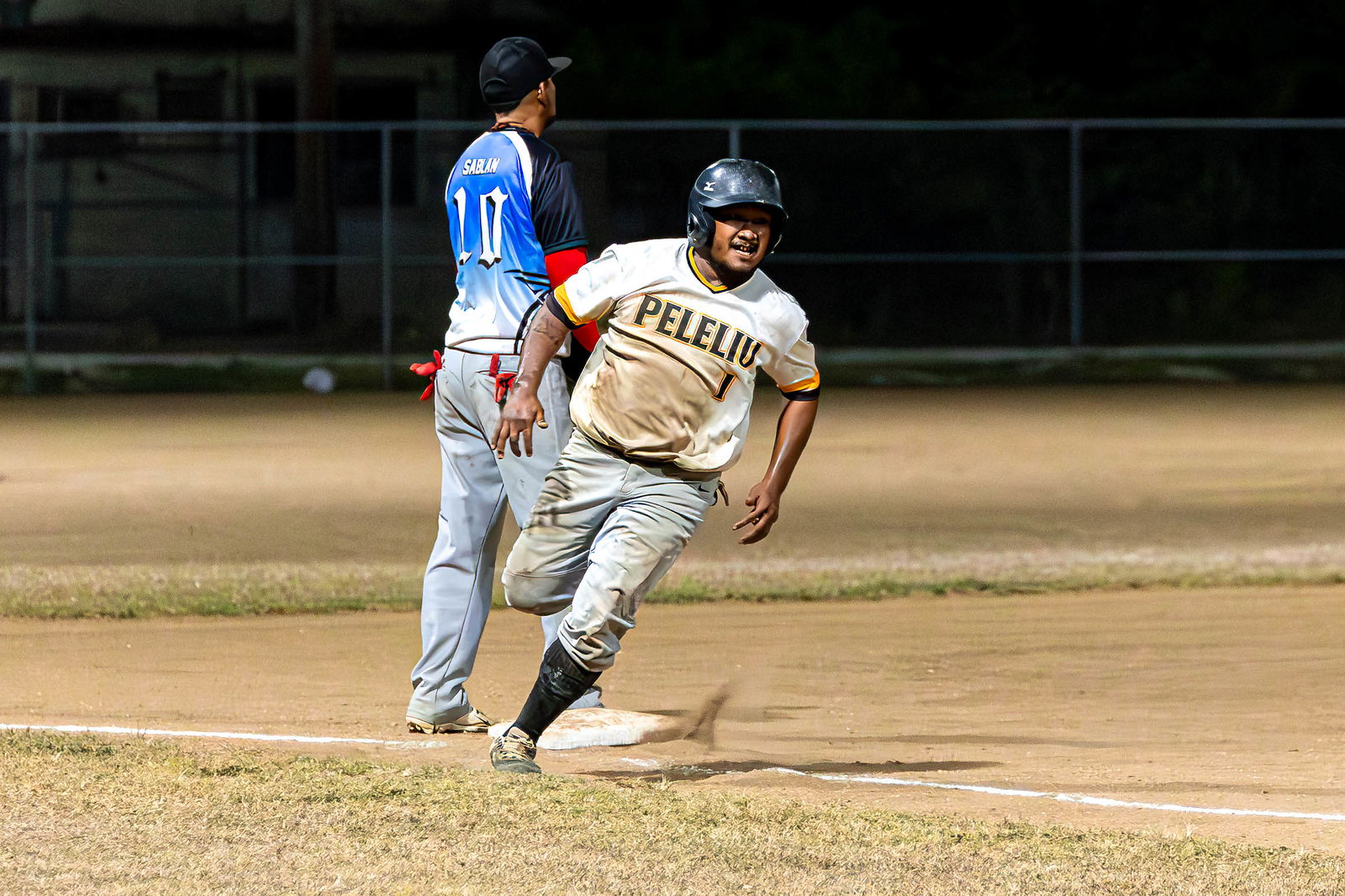The Bandits’ Virgil Secharmidal celebrates as he makes his way home for a run scored during a game against the Blue Sharks in the 2024 Tan Holdings Saipan Baseball League at the Francisco "Tan Ko" Palacios Baseball Field.