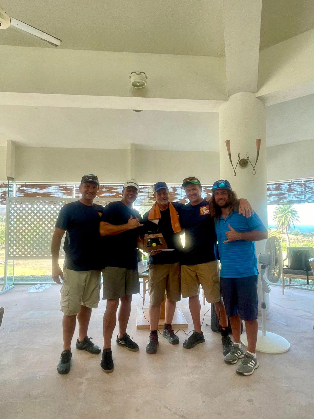 From left, "The Slice is Right" team members Rob Jordan, Bryan Anderson, Dale Roberts and Steve Beyer pose with the championship trophy alongside event organizer, Dan Wollak, at the conclusion of the 15th Wollak Golf Classic at the Kingfisher Golf Links on Sunday.