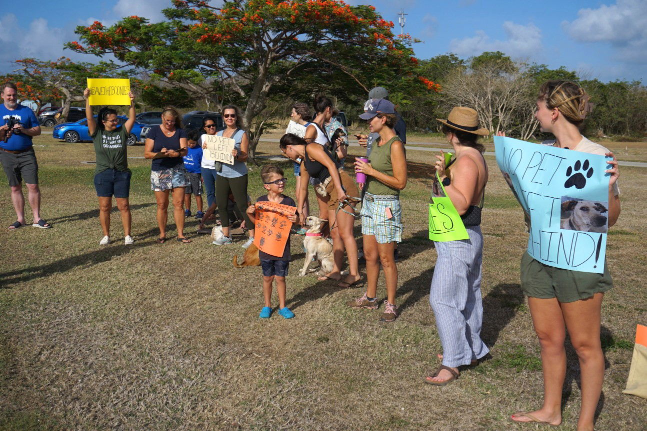 Animal welfare activists protest United Airlines’ lack of pet shipping services for the CNMI on Wednesday.
