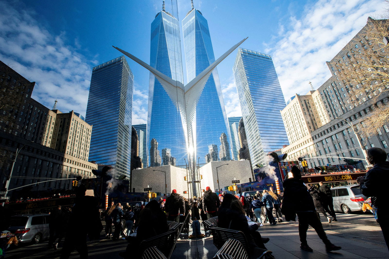 People walk around the Financial District near the New York Stock Exchange in New York, Dec. 29, 2023.