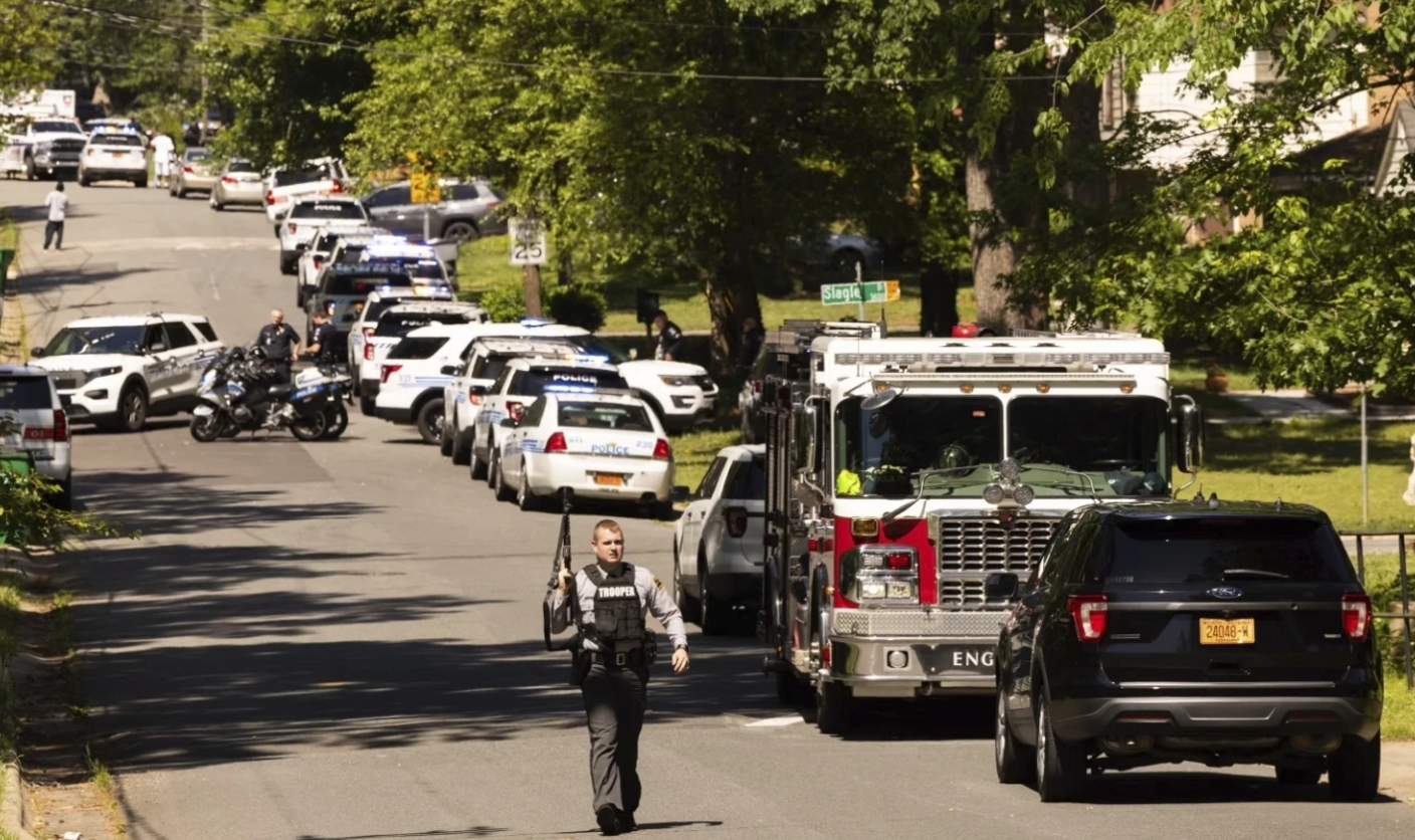 Multiple law enforcement vehicles respond in the neighborhood where several officers on a task force trying to serve a warrant were shot in Charlotte, N.C., Monday, April 29, 2024.