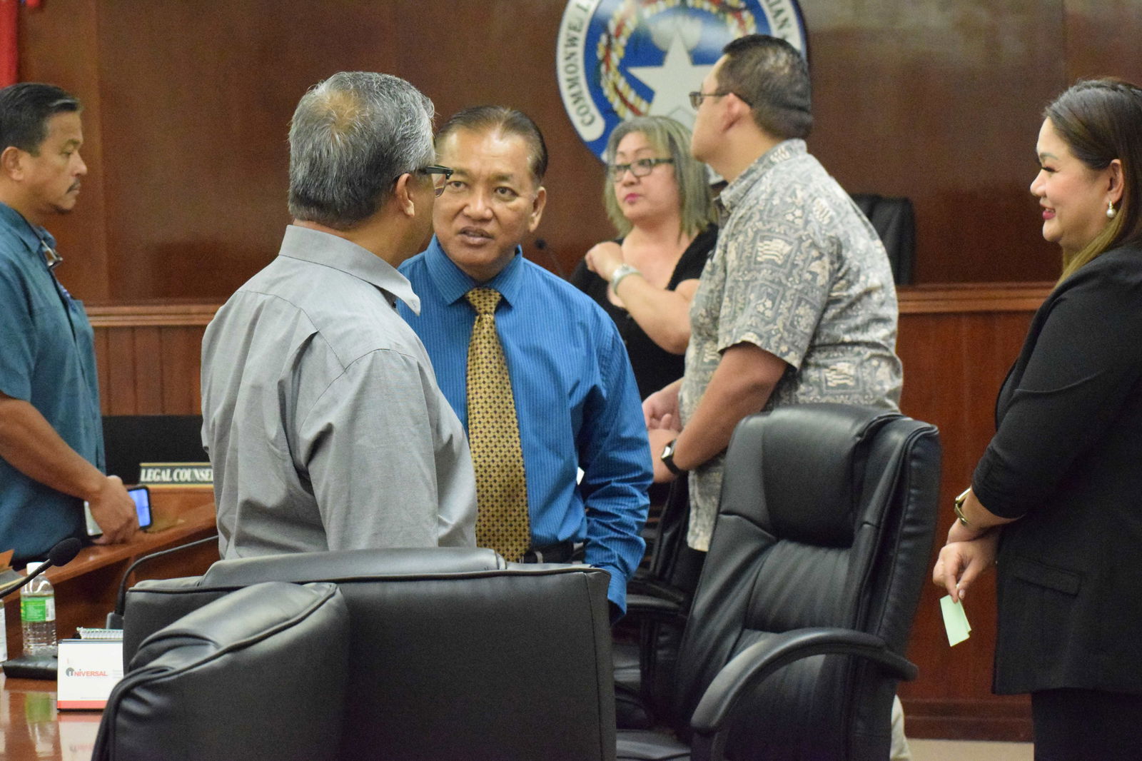 Sen. Frank Q. Cruz, center, confers with Sen. Paul A. Manglona during a break from a Senate session on Monday last week. Also in the photo are Sen. Jude U. Hofschneider, Senate President Edith Deleon Guerrero, Senate Vice President Donald Manglona and Senate Floor Leader Corina Magofna.