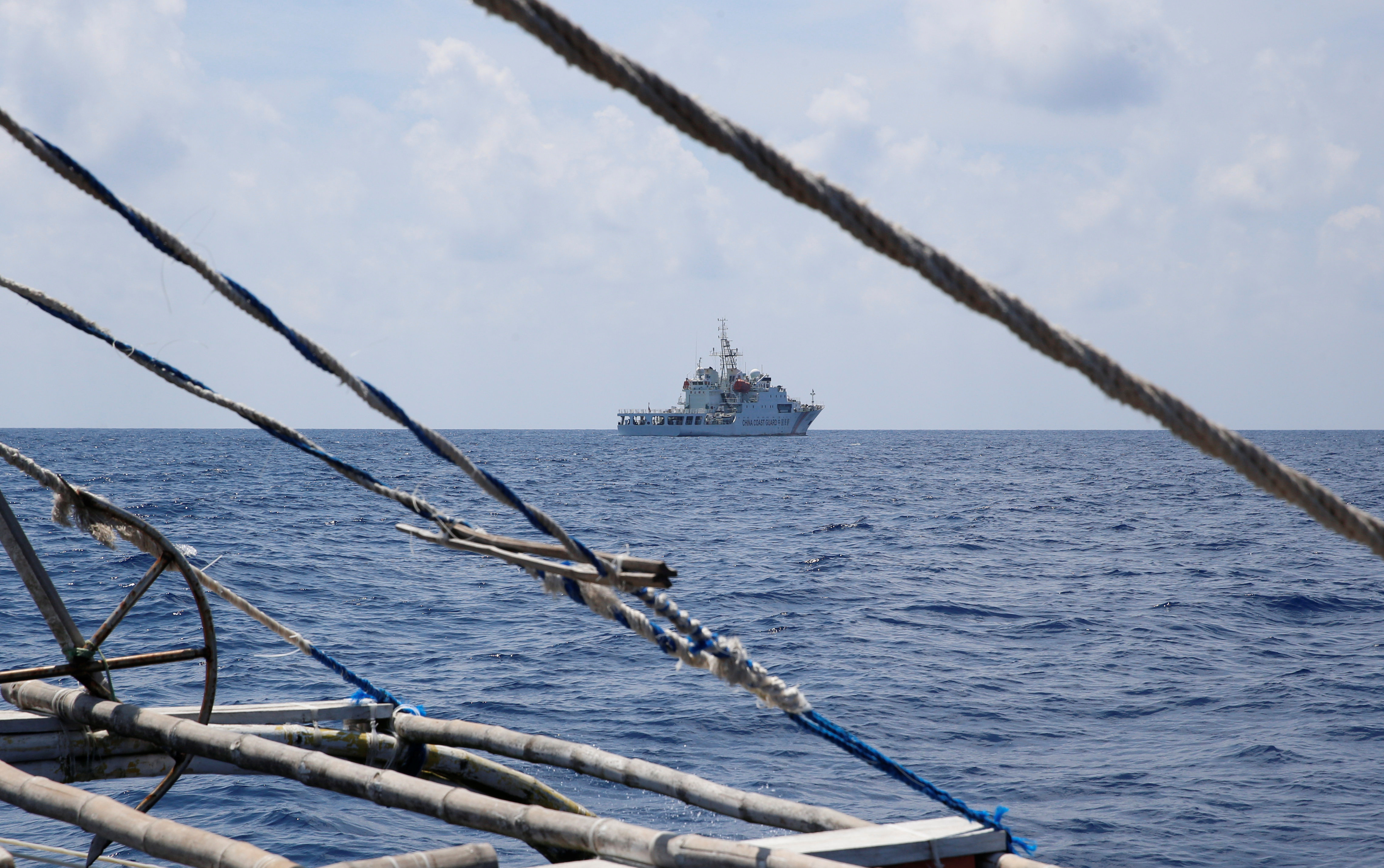 A China Coast Guard ship is seen from a Philippine fishing boat at the disputed Scarborough Shoal on April 6, 2017.