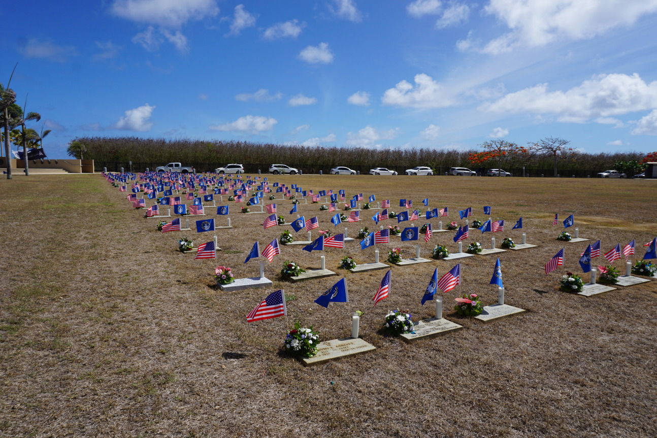 CNMI and American flags mark the graves of veterans and their family members in Marpi.