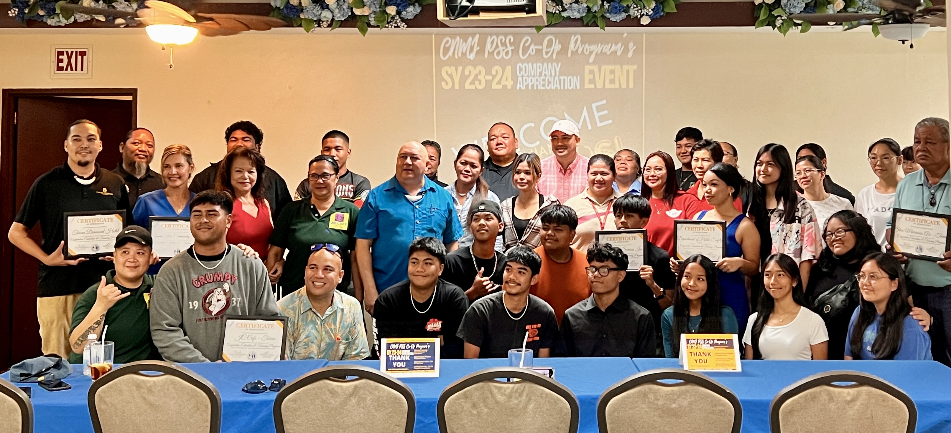 Tinian business representatives and Tinian Department of Public Safety officials pose for a photo with the 19 students-interns of the PSS Cooperative Education Program and Tinian Junior Senior High School as they celebrate the end of the internship program Wednesday. Joining them are Commissioner of Education Dr. Lawrence F. Camacho, Associate Commissioner for Administrative Services Eric Magofna, TJSHS Principal Liz Persinzki, and Tinian Cooperative Education and Training Teacher Patricia Aguon.