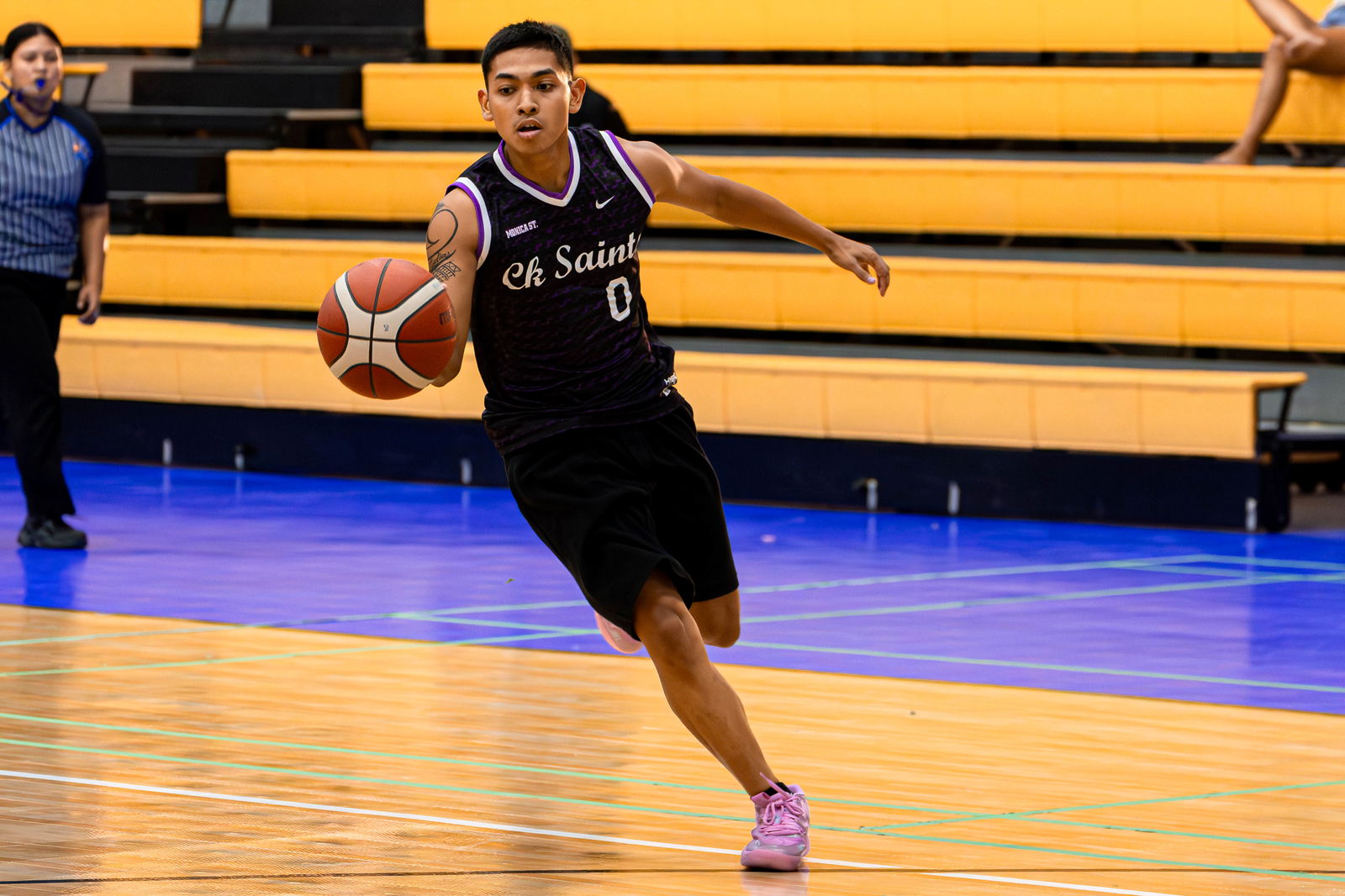 The Saints' Dominic Blas pushes forward for the fastbreak finish during a quarterfinal game against Lamesa Kusina in the Michelob Ultra Cup 2024 at the Ada gym on Tuesday.