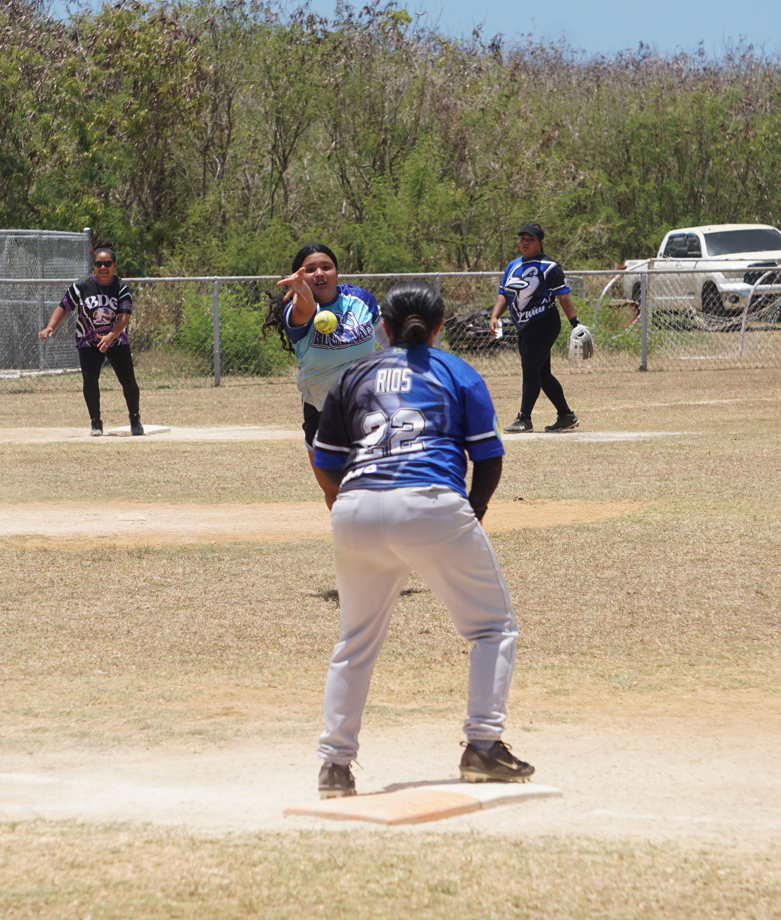 Lady Blue Jays pitcher Angel Deleon Guerrero throws to first baseman Keolani Rios for an out against BDE in game 2 of the 2024 Budweiser Belau Amateur Softball Association League ladies division championship series at the Dandan baseball field on Sunday.