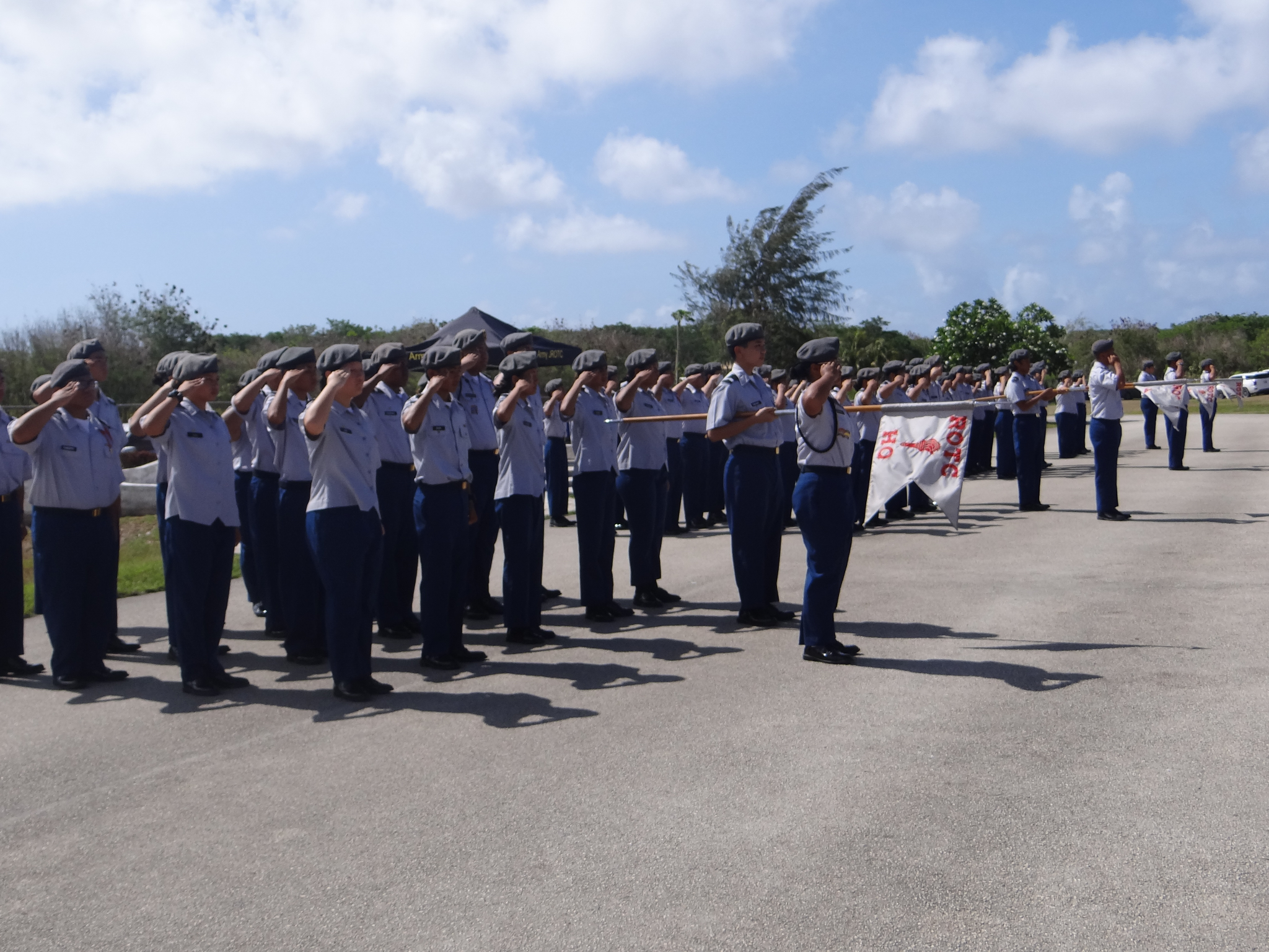 The battalion cadets salute during the singing of the national and CNMI anthems.