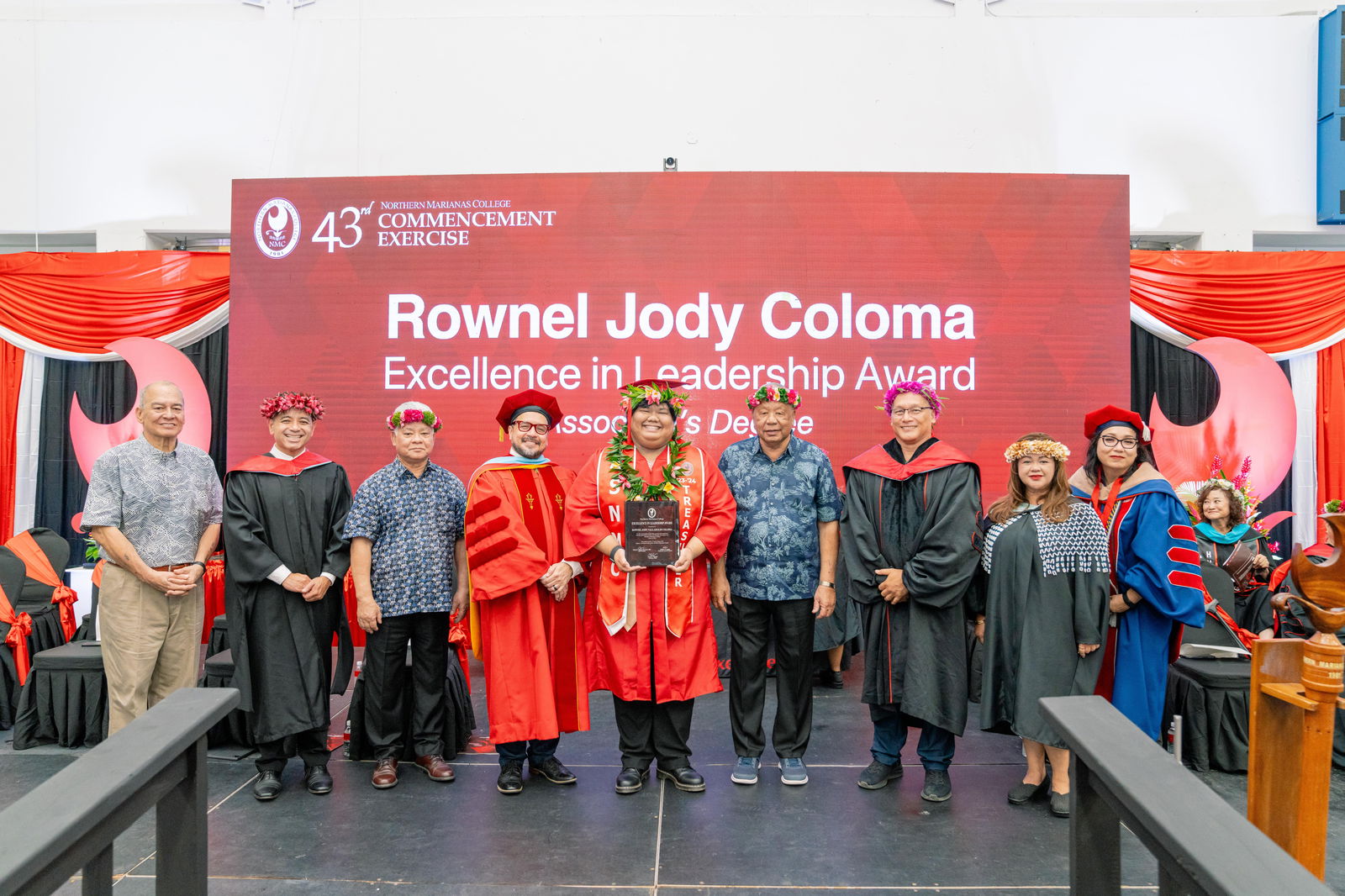 Rownel Jody Valladolid Coloma, who graduated with an Associate of Applied Science in Business Administration, Business Management and Accounting Emphasis, was honored with the Excellence in Leadership Award at Northern Marianas College’s 43rd Commencement Exercise on May 17, 2024, at the Marianas High School Gymnasium. Pictured with Coloma, from left, are keynote speaker U.S. Congressman Gregorio Kilili Camacho Sablan, NMC Vice President for Administration and Advancement Frankie Eliptico, CNMI Gov. Arnold I. Palacios, NMC President Galvin Deleon Guerrero, EdD, CNMI Lt. Gov. David M. Apatang, NMC Board of Regents Chair Charles Cepeda, NMC Dean of Student Support Services Charlotte Cepeda, and NMC Acting Dean of Academic Programs and Services Dr. Barbara Hunter.