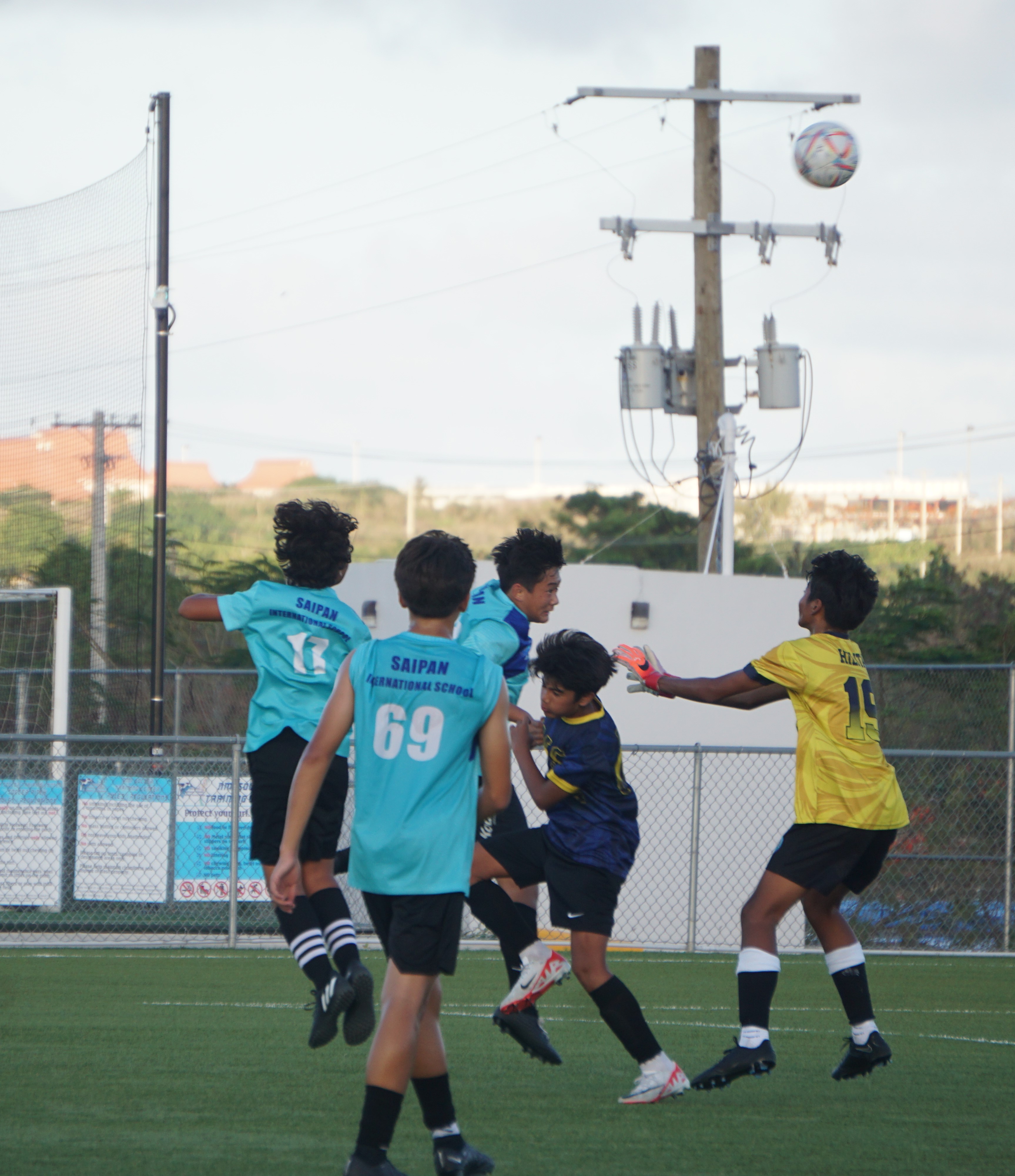 Saipan International School's Matthew Hwang connects a header in a battle for possession against Hopwood 1 in the boys middle school division title match of the NMIFA-PSS Interscholastic Soccer League SY23-24 at the NMI Soccer Training Center in Koblerville on Thursday.