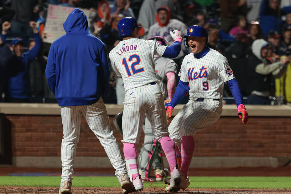 New York Mets left fielder Brandon Nimmo (9) celebrates with shortstop Francisco Lindor (12) after hitting a walk-off two run home run to defeat the Atlanta Braves at Citi Field in New York City, May 12, 2024.