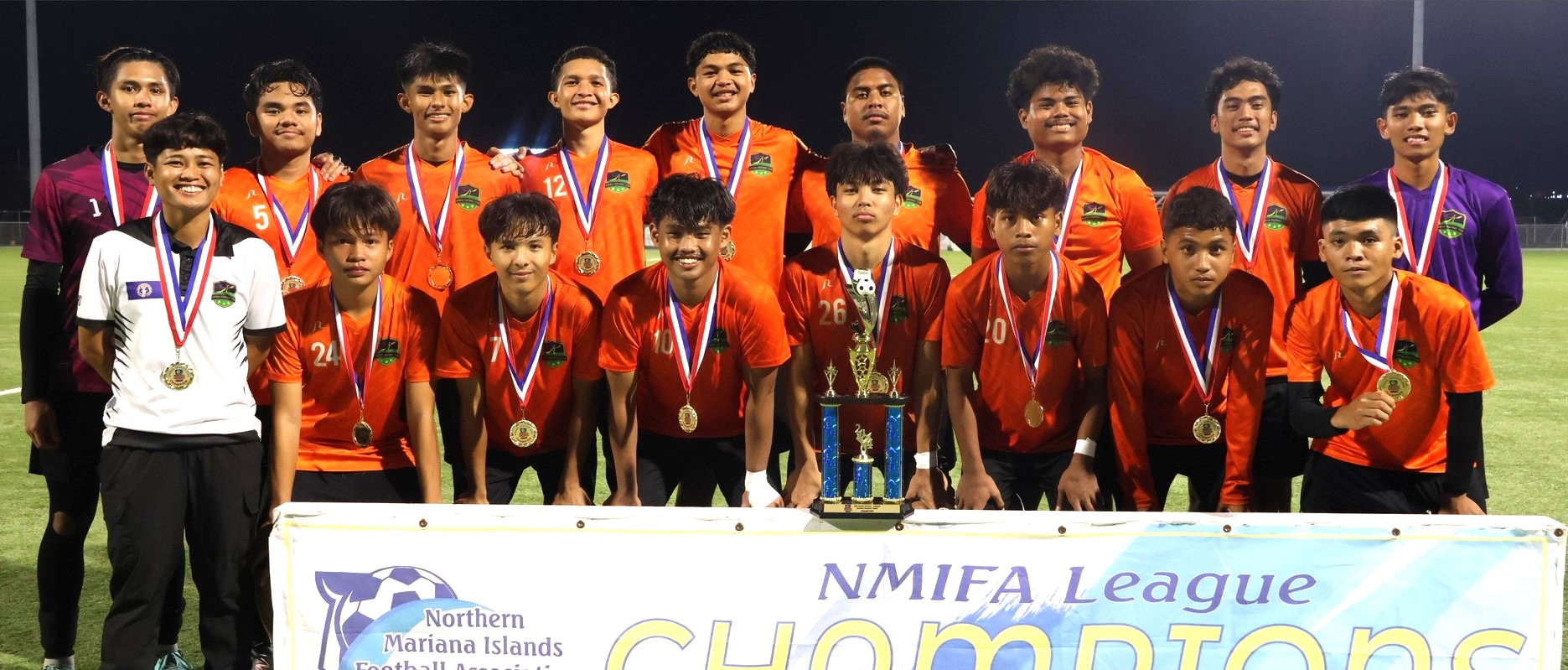 Kanoa Football Club players pose with their medals and  the championship trophy of the Marianas Soccer League 1 after defeating Matansa Football Club in the finals, 4-2, at the NMI Soccer Training Center in Koblerville last Sunday.