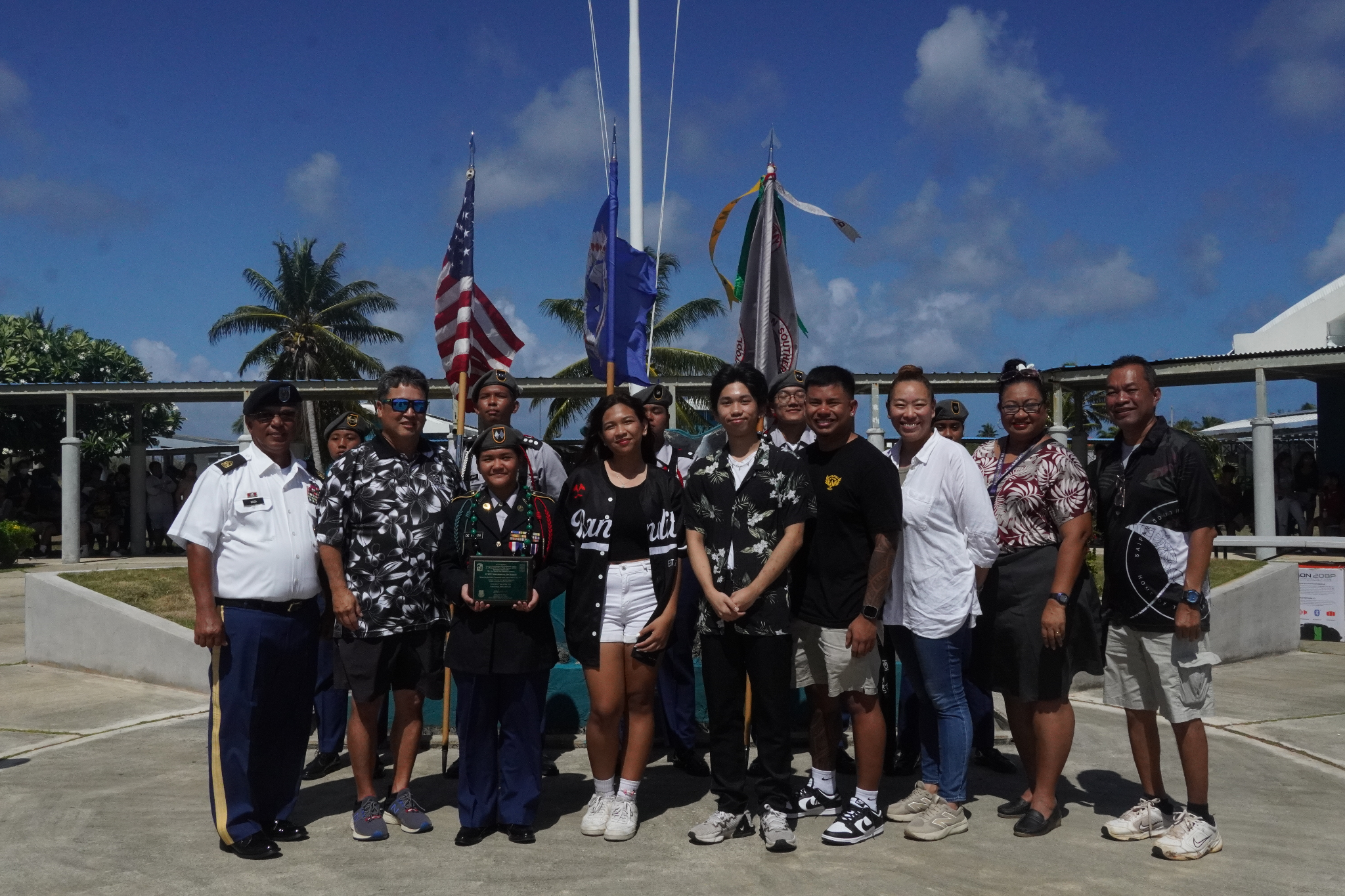 The outgoing Battalion Commander C/LTC De Ramos, Mechaella holds her plaque as she poses for a photo with friends and SSHS officials.